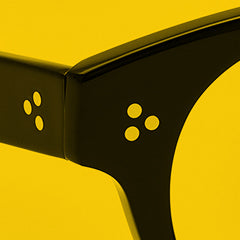 A close-up of three dot rivets