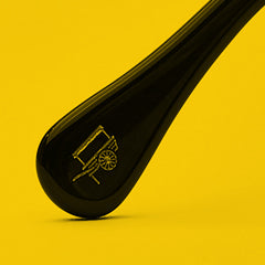An acetate temple tip featuring the MOSCOT logo