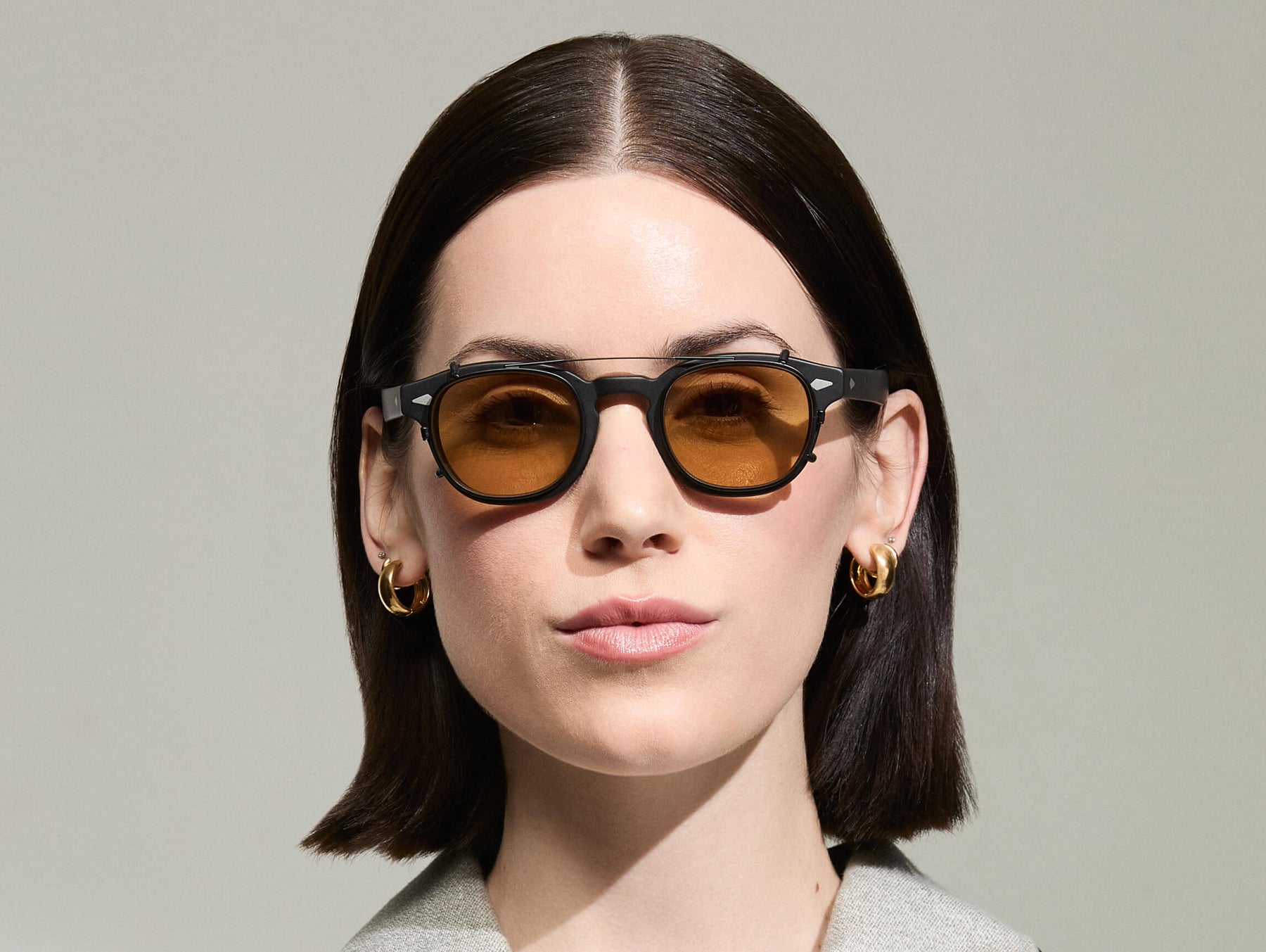 The Model is wearing The CLIPTOSH in Matte Black in size 46 with Amber Tinted Lenses The Model is wearing The CLIPTOSH in Matte Black in size 46 with Amber Tinted Lenses