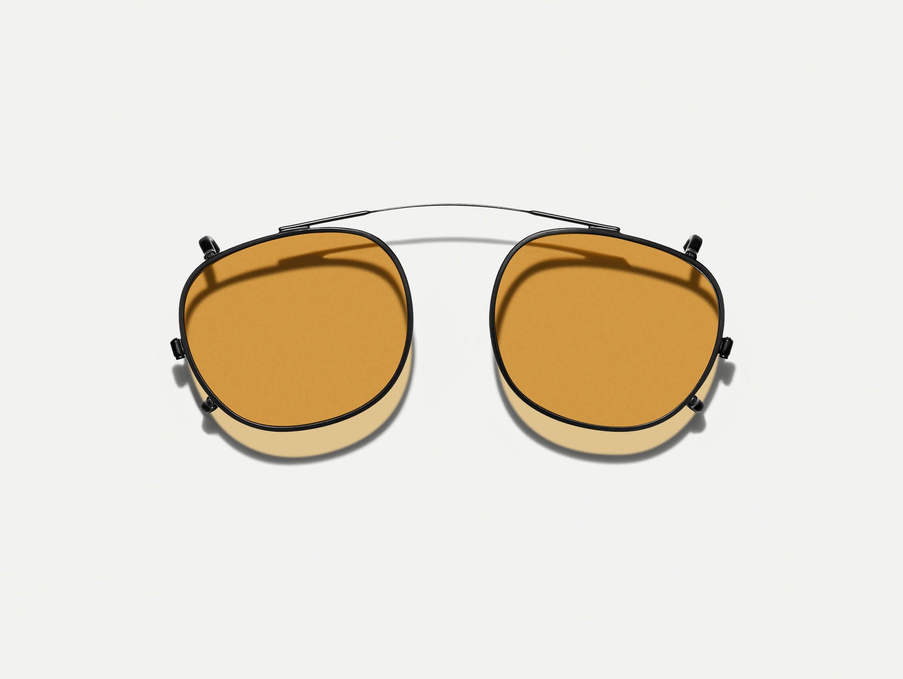 The CLIPTOSH in Matte Black with Amber Tinted Lenses The CLIPTOSH in Matte Black with Amber Tinted Lenses