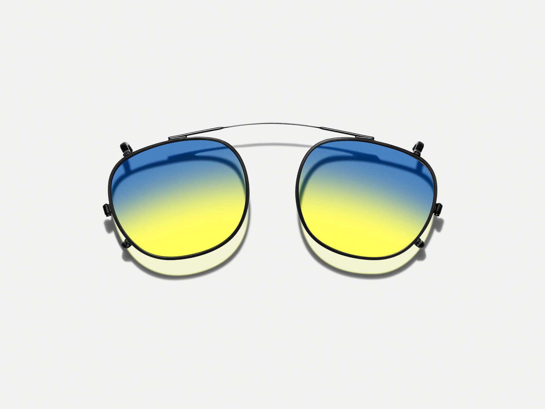 The CLIPTOSH in Matte Black with Aqua Sunrise Tinted Lenses The CLIPTOSH in Matte Black with Aqua Sunrise Tinted Lenses