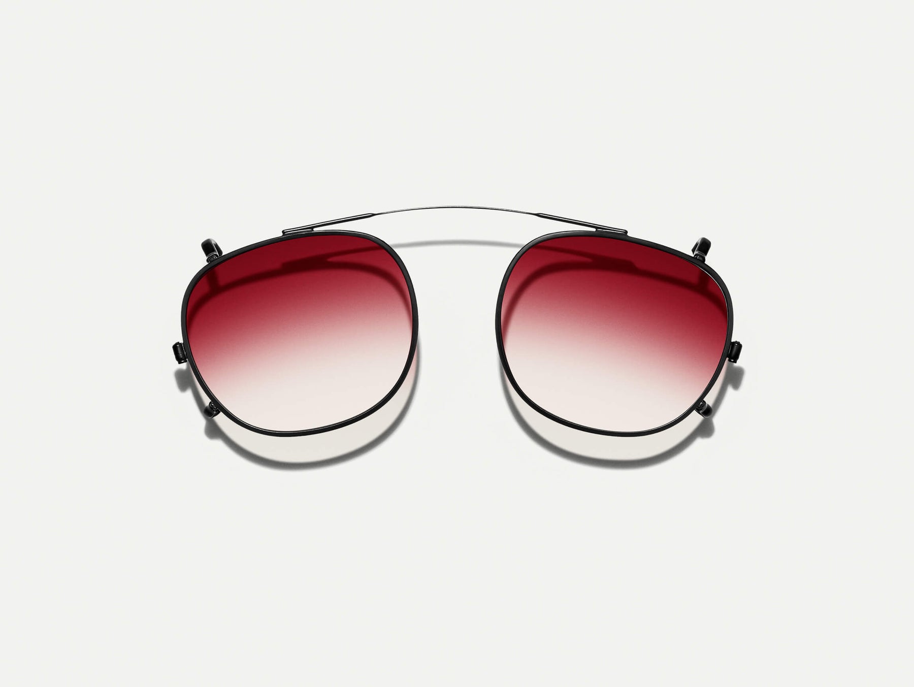 The CLIPTOSH in Matte Black with Big Apple Fade Tinted Lenses The CLIPTOSH in Matte Black with Big Apple Fade Tinted Lenses