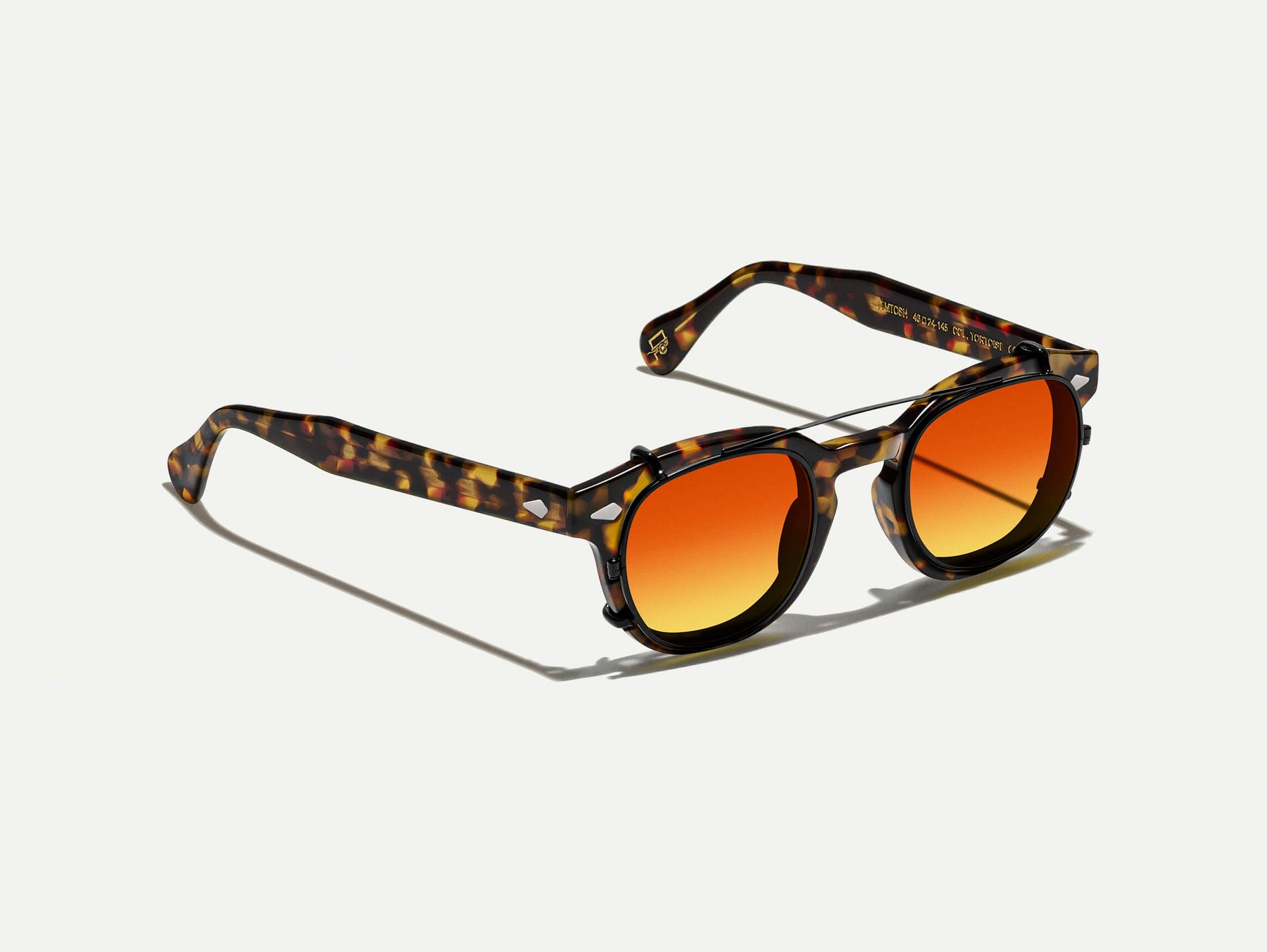 The CLIPTOSH in Matte Black with Candy Corn Tinted Lenses The CLIPTOSH in Matte Black with Candy Corn Tinted Lenses