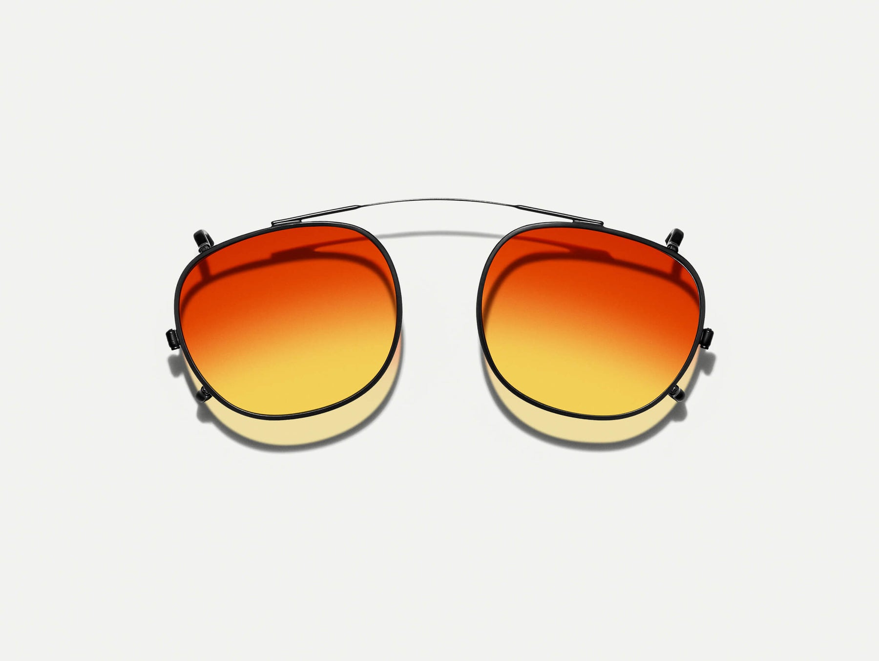 The CLIPTOSH in Matte Black with Candy Corn Tinted Lenses The CLIPTOSH in Matte Black with Candy Corn Tinted Lenses