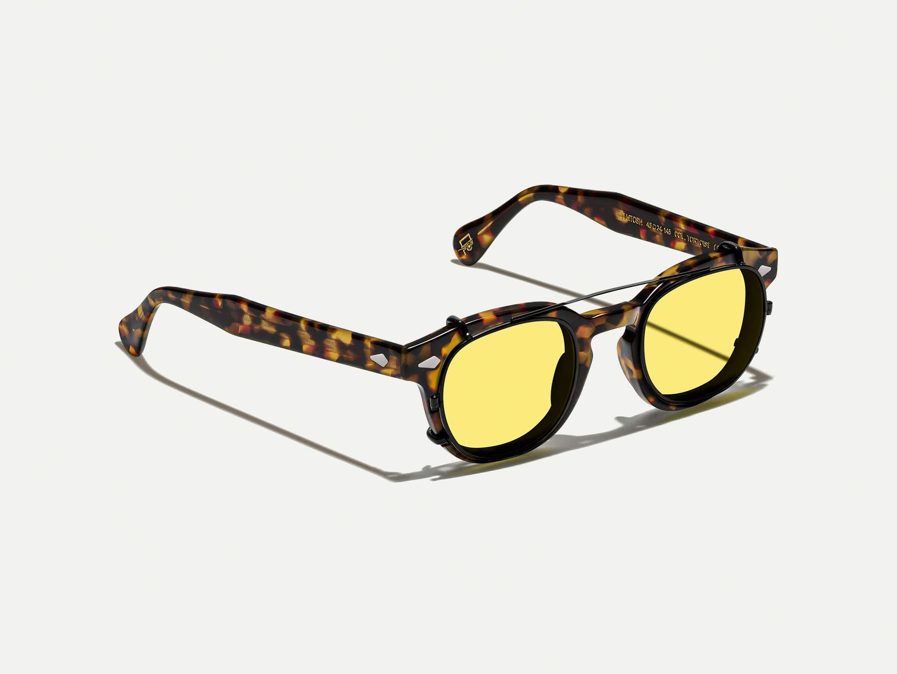 The CLIPTOSH in Matte Black with Mellow Yellow Tinted Lenses The CLIPTOSH in Matte Black with Mellow Yellow Tinted Lenses