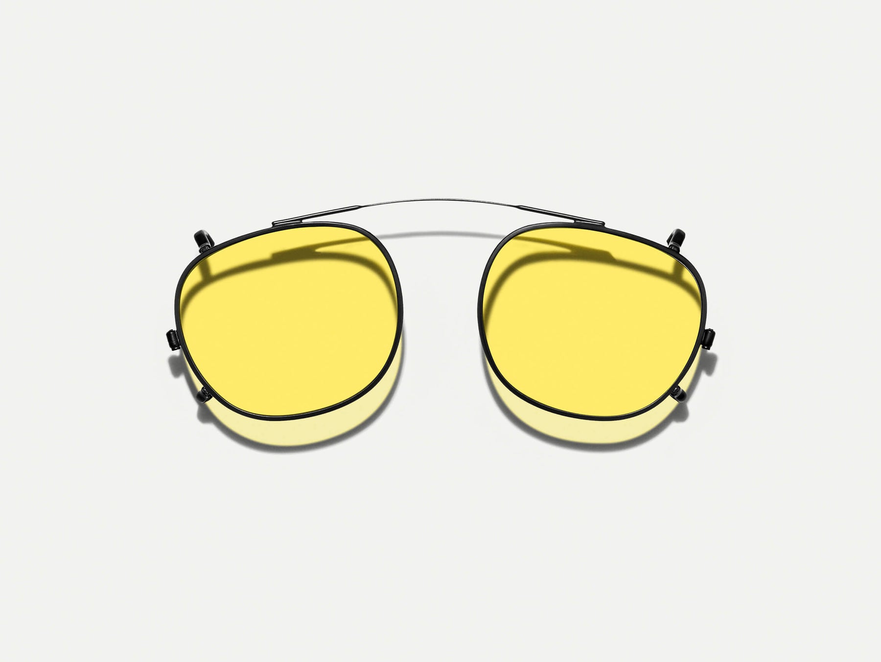 The CLIPTOSH in Matte Black with Mellow Yellow Tinted Lenses The CLIPTOSH in Matte Black with Mellow Yellow Tinted Lenses