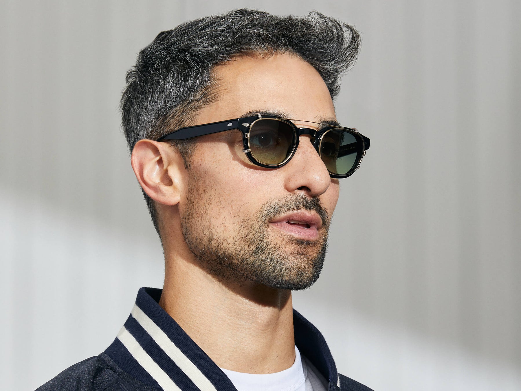 Model is wearing The CLIPTOSH in Gold in size 46 with Forest Wood Tinted Lenses Model is wearing The CLIPTOSH in Gold in size 46 with Forest Wood Tinted Lenses