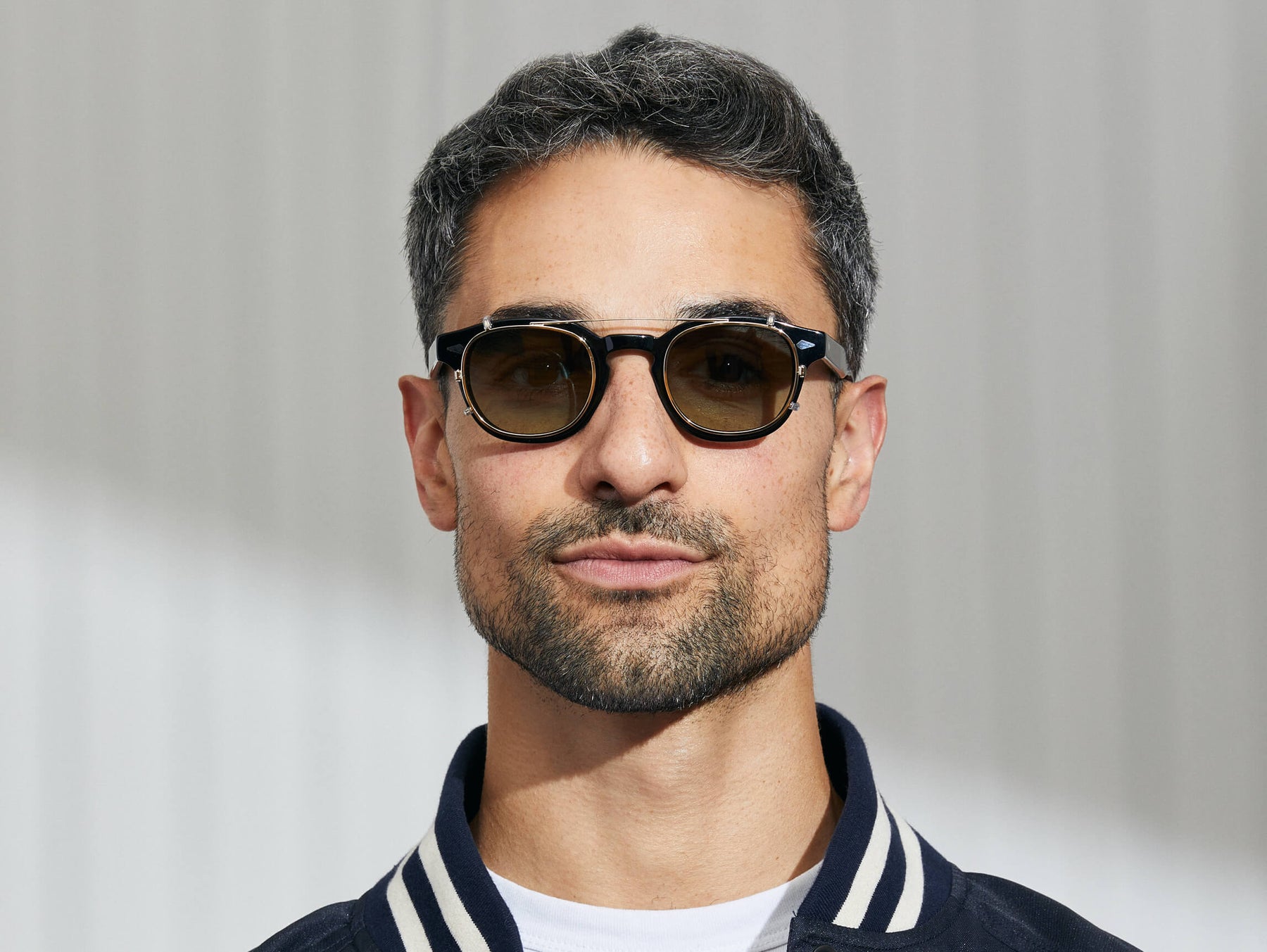 Model is wearing The CLIPTOSH in Gold in size 46 with Forest Wood Tinted Lenses Model is wearing The CLIPTOSH in Gold in size 46 with Forest Wood Tinted Lenses