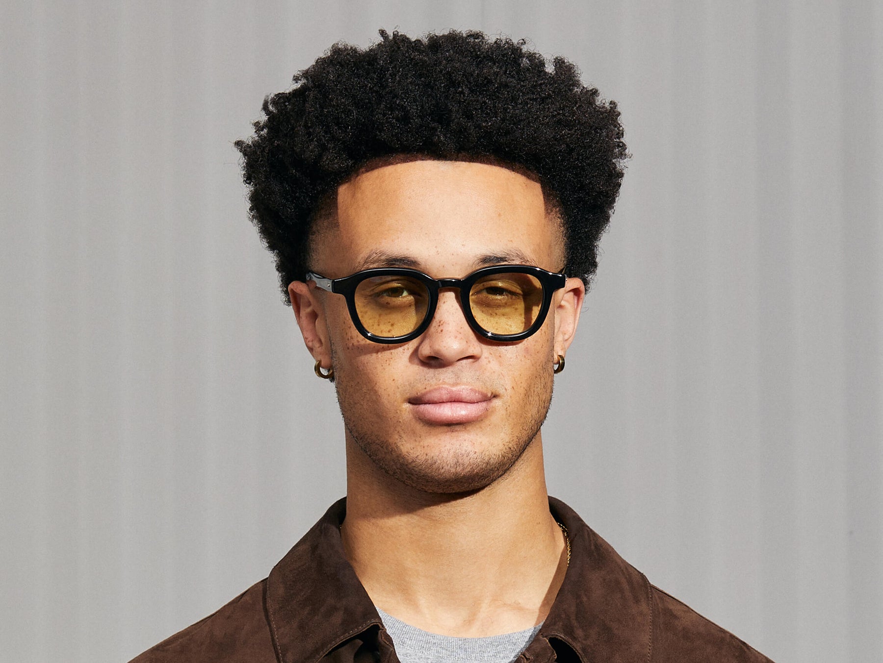 Model is wearing The DAHVEN in Black in size 47 with Limelight Tinted Lenses Model is wearing The DAHVEN in Black in size 47 with Limelight Tinted Lenses