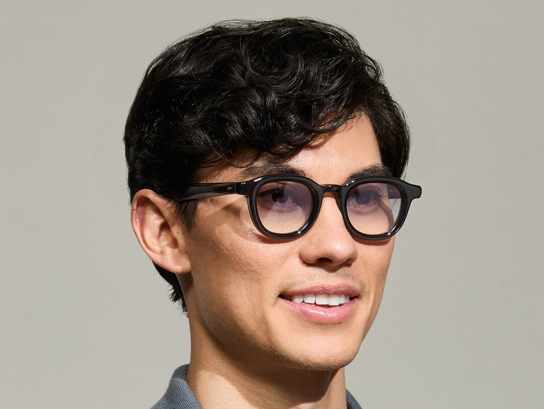 Model is wearing The DAHVEN in Grey in size 44 with American Grey Fade Tinted Lenses Model is wearing The DAHVEN in Grey in size 44 with American Grey Fade Tinted Lenses