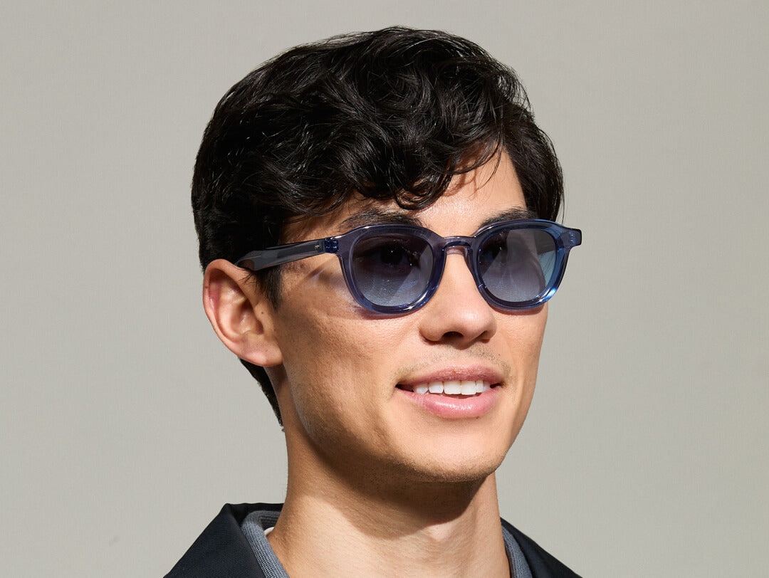 Model is wearing The DAHVEN in Sapphire in size 47 with Denim Blue Tinted Lenses Model is wearing The DAHVEN in Sapphire in size 47 with Denim Blue Tinted Lenses