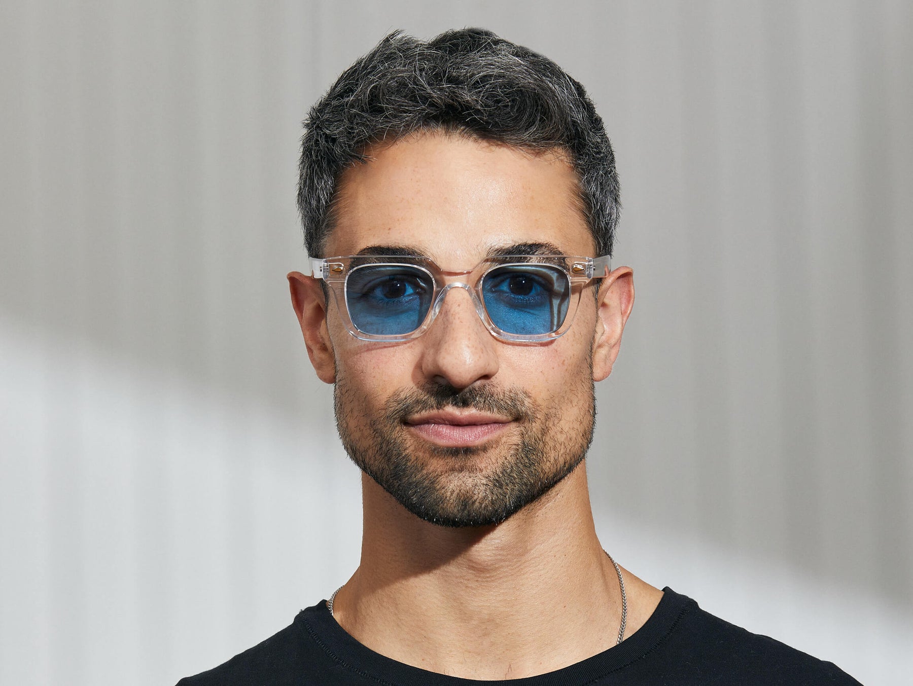 Model is wearing The GROBER in Crystal in size 45 with Celebrity Blue Tinted Lenses Model is wearing The GROBER in Crystal in size 45 with Celebrity Blue Tinted Lenses