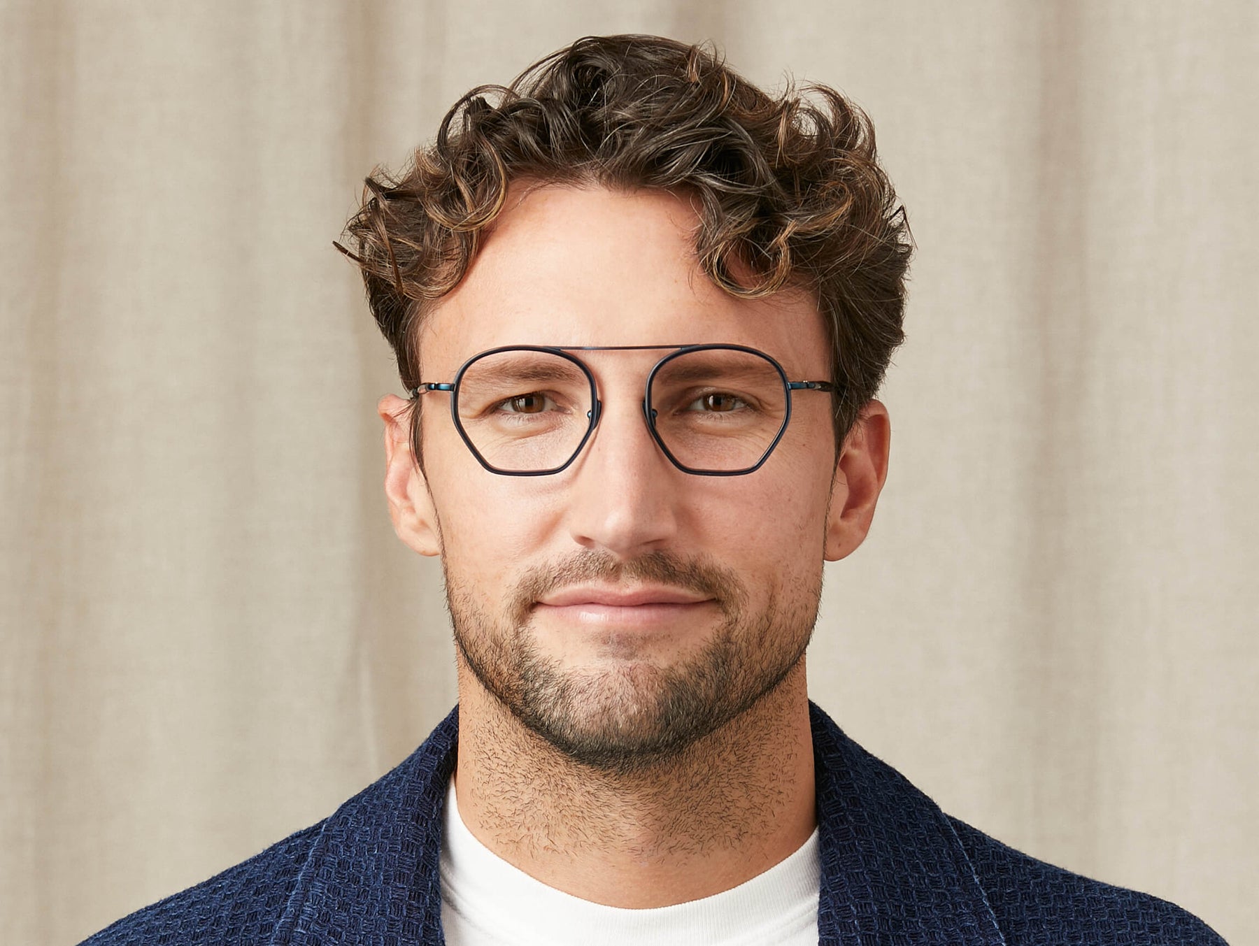 Model is wearing The KUGEL in size 49 in Navy Model is wearing The KUGEL in size 49 in Navy