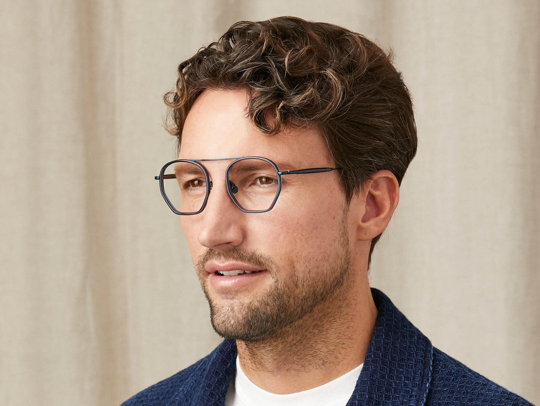 Model is wearing The KUGEL in size 49 in Navy Model is wearing The KUGEL in size 49 in Navy