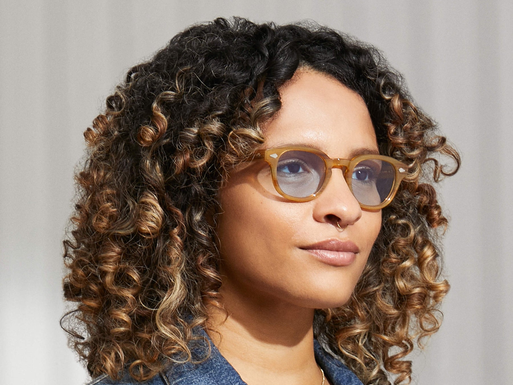 Model is wearing The LEMTOSH in Blonde in size 46 with Bel Air Blue Tinted Lenses Model is wearing The LEMTOSH in Blonde in size 46 with Bel Air Blue Tinted Lenses