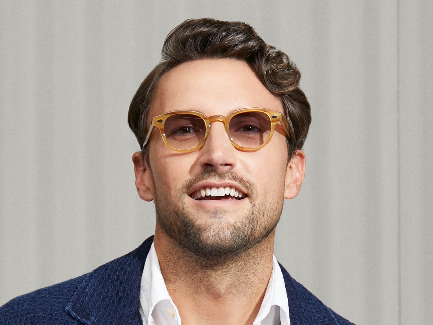 Model is wearing The LEMTOSH in Blonde in size 46 with American Grey Fade Tinted Lenses Model is wearing The LEMTOSH in Blonde in size 46 with American Grey Fade Tinted Lenses