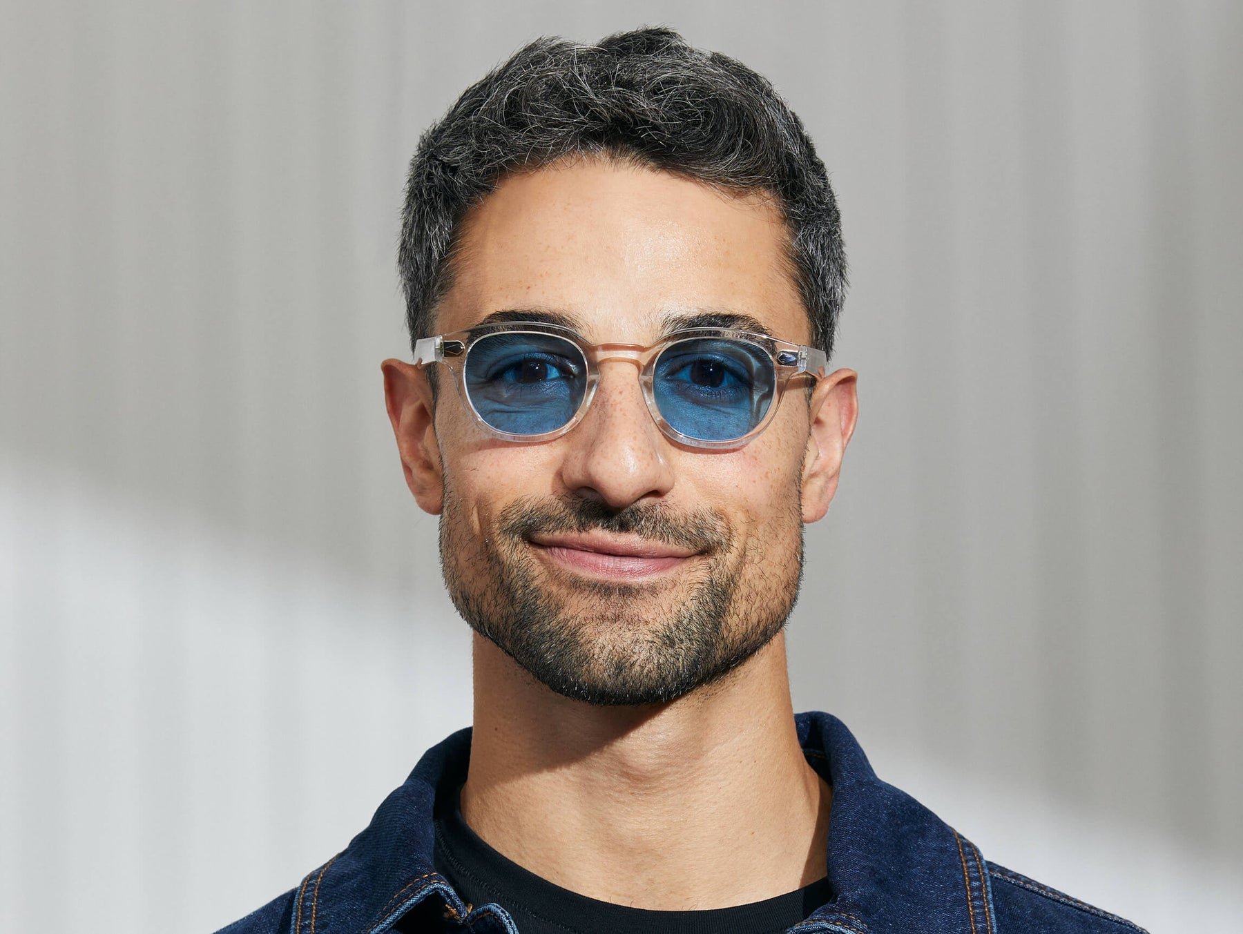 Model is wearing The LEMTOSH in Crystal in size 46 with Celebrity Blue Tinted Lenses Model is wearing The LEMTOSH in Crystal in size 46 with Celebrity Blue Tinted Lenses