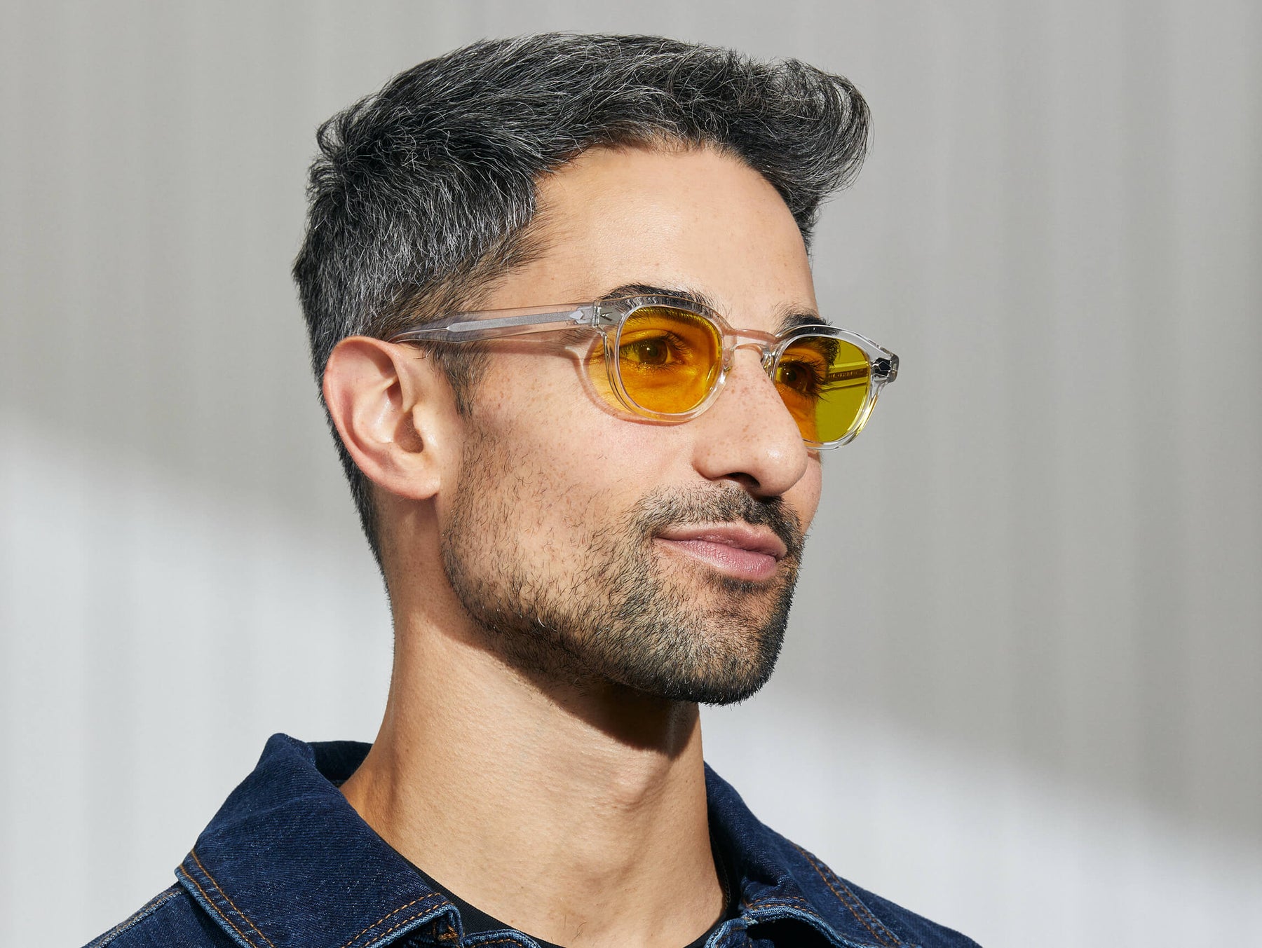 Model is wearing The LEMTOSH in Crystal in size 46 with Mellow Yellow Tinted Lenses Model is wearing The LEMTOSH in Crystal in size 46 with Mellow Yellow Tinted Lenses