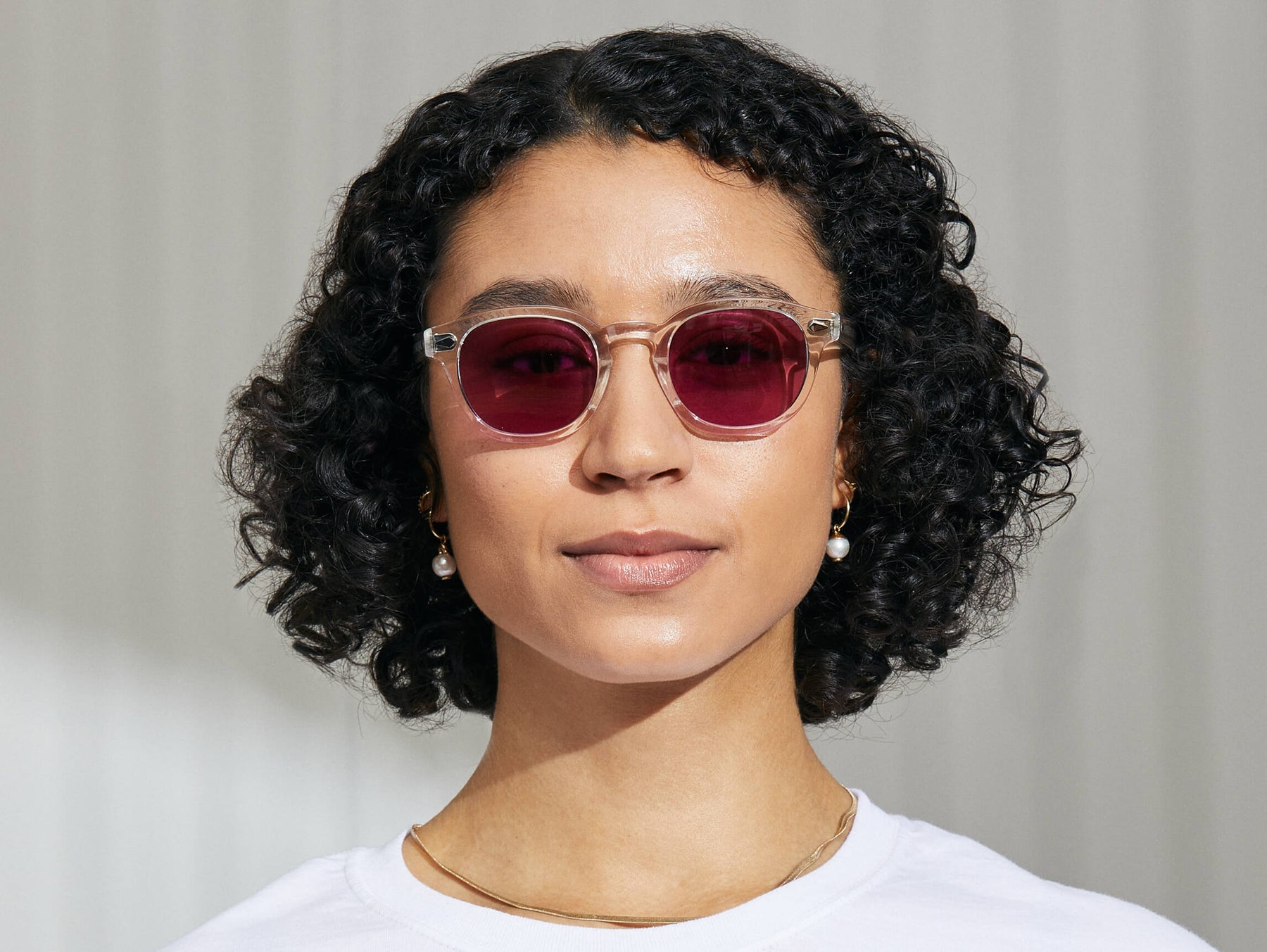 Model is wearing The LEMTOSH in Crystal in size 49 with Purple Nurple Tinted Lenses Model is wearing The LEMTOSH in Crystal in size 49 with Purple Nurple Tinted Lenses