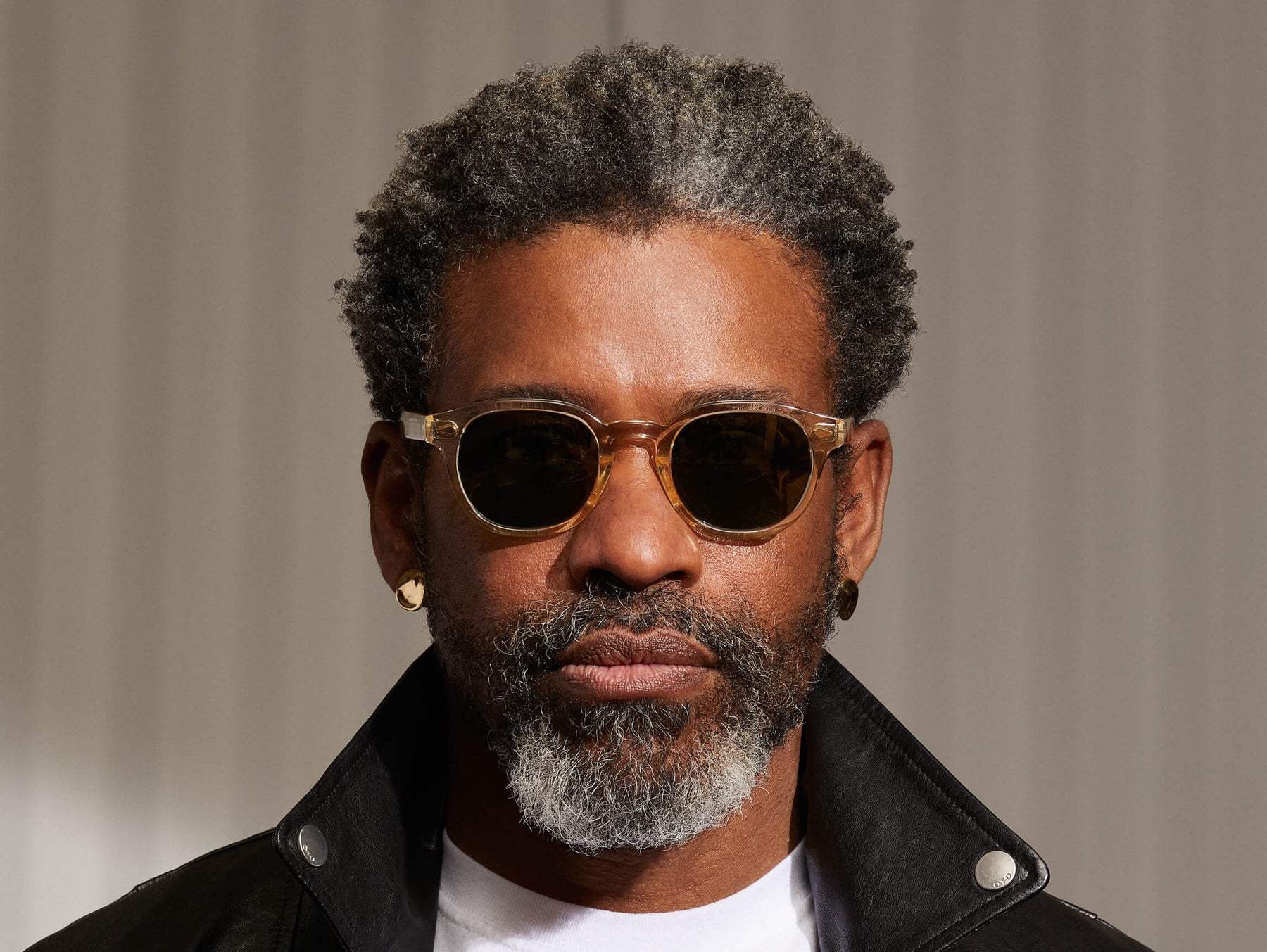 Model is wearing The LEMTOSH SUN in Flesh in size 49 with Calibar Green Glass Lenses Model is wearing The LEMTOSH SUN in Flesh in size 49 with Calibar Green Glass Lenses