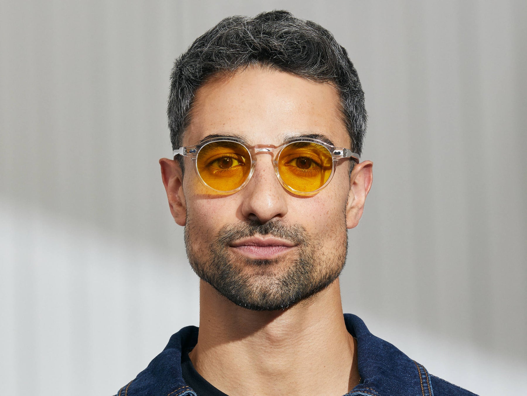 Model is wearing The MILTZEN in Crystal in size 46 with Mellow Yellow Tinted Lenses Model is wearing The MILTZEN in Crystal in size 46 with Mellow Yellow Tinted Lenses