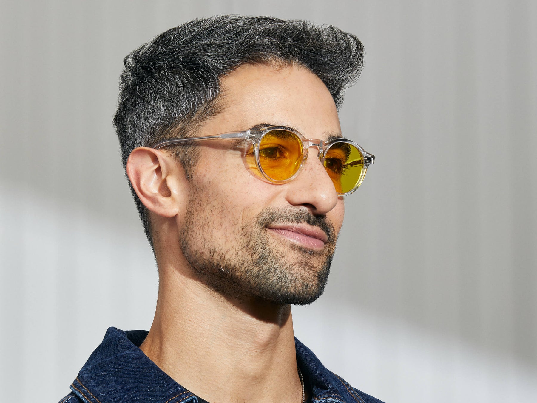 Model is wearing The MILTZEN in Crystal in size 46 with Mellow Yellow Tinted Lenses Model is wearing The MILTZEN in Crystal in size 46 with Mellow Yellow Tinted Lenses