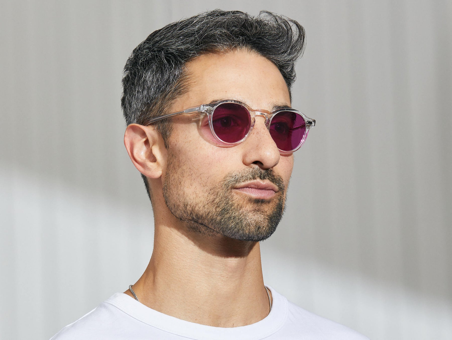 Model is wearing The MILTZEN in Crystal in size 46 with Purple Nurple Tinted Lenses Model is wearing The MILTZEN in Crystal in size 46 with Purple Nurple Tinted Lenses