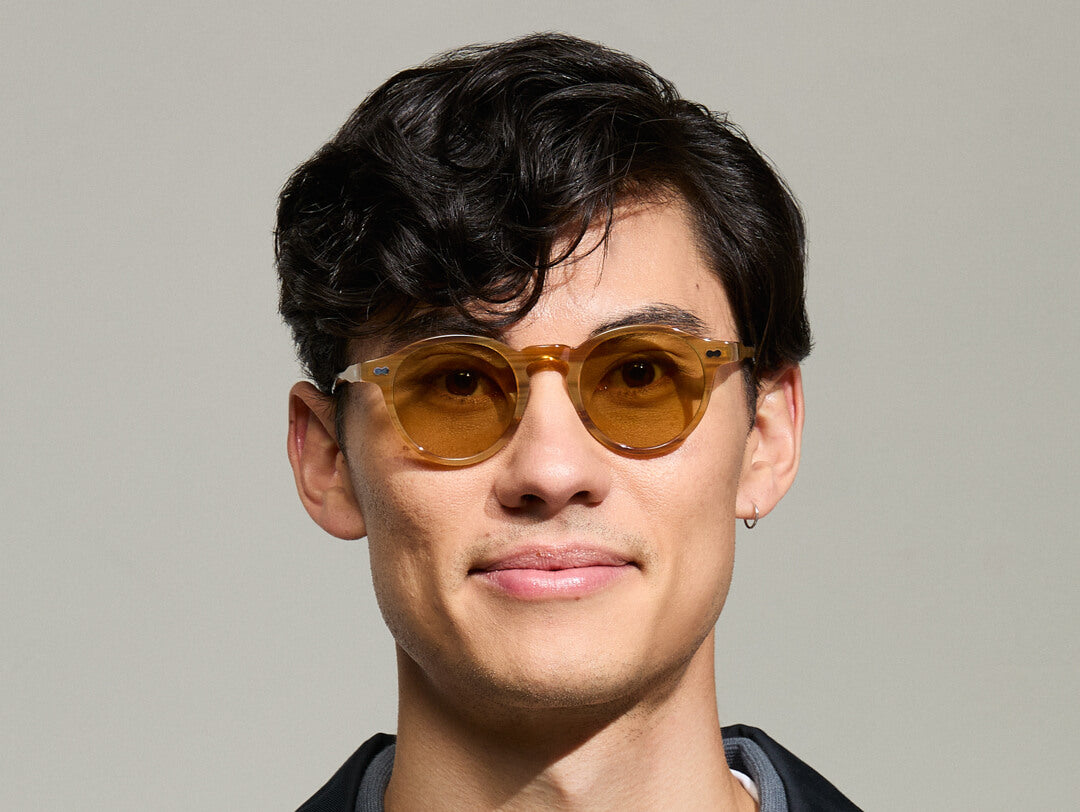 Model is wearing The MILTZEN in Blonde in size 46 with Amber Tinted Lenses Model is wearing The MILTZEN in Blonde in size 46 with Amber Tinted Lenses