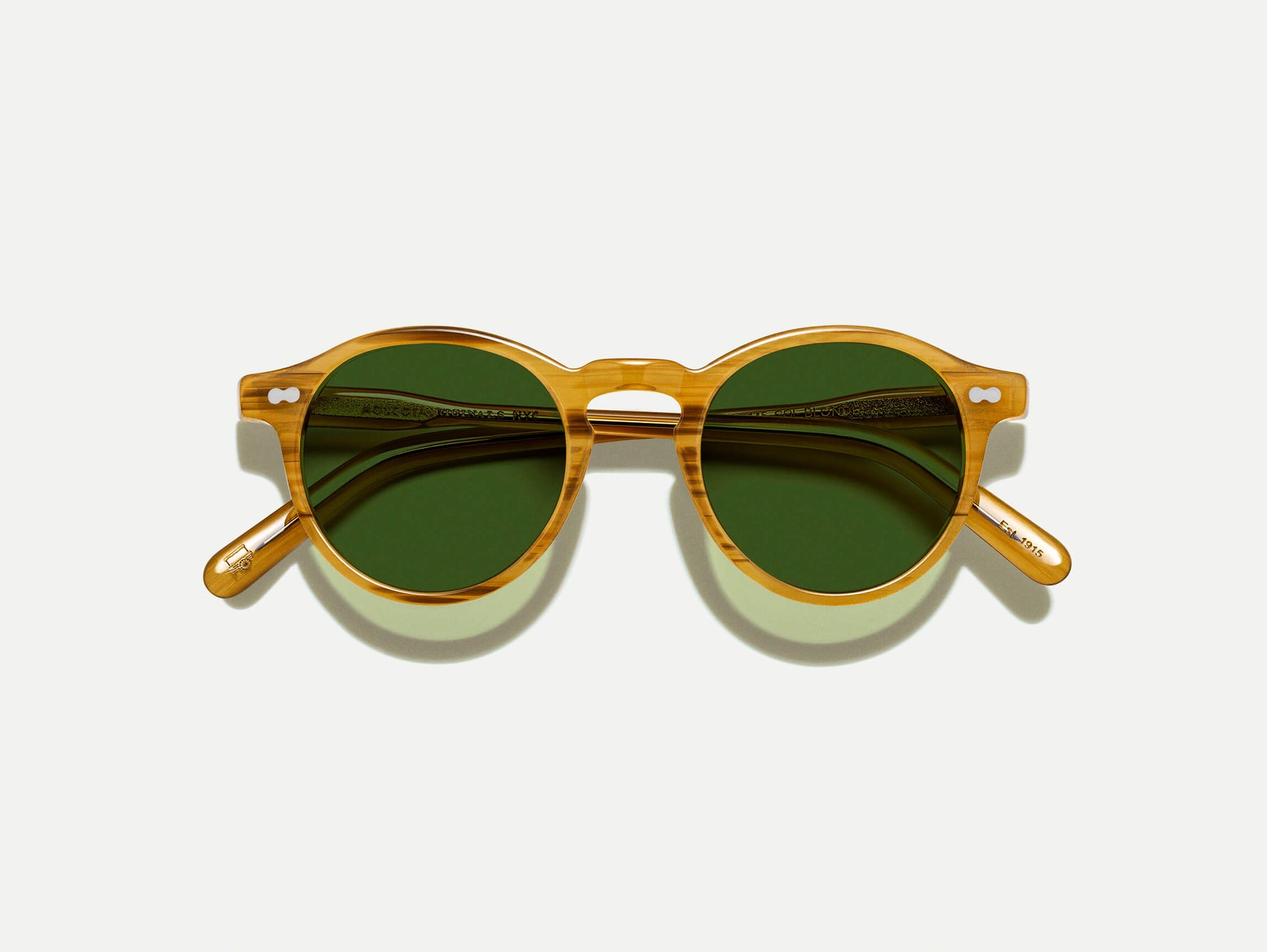 The MILTZEN in Blonde with Calibar Green Glass Lenses The MILTZEN in Blonde with Calibar Green Glass Lenses