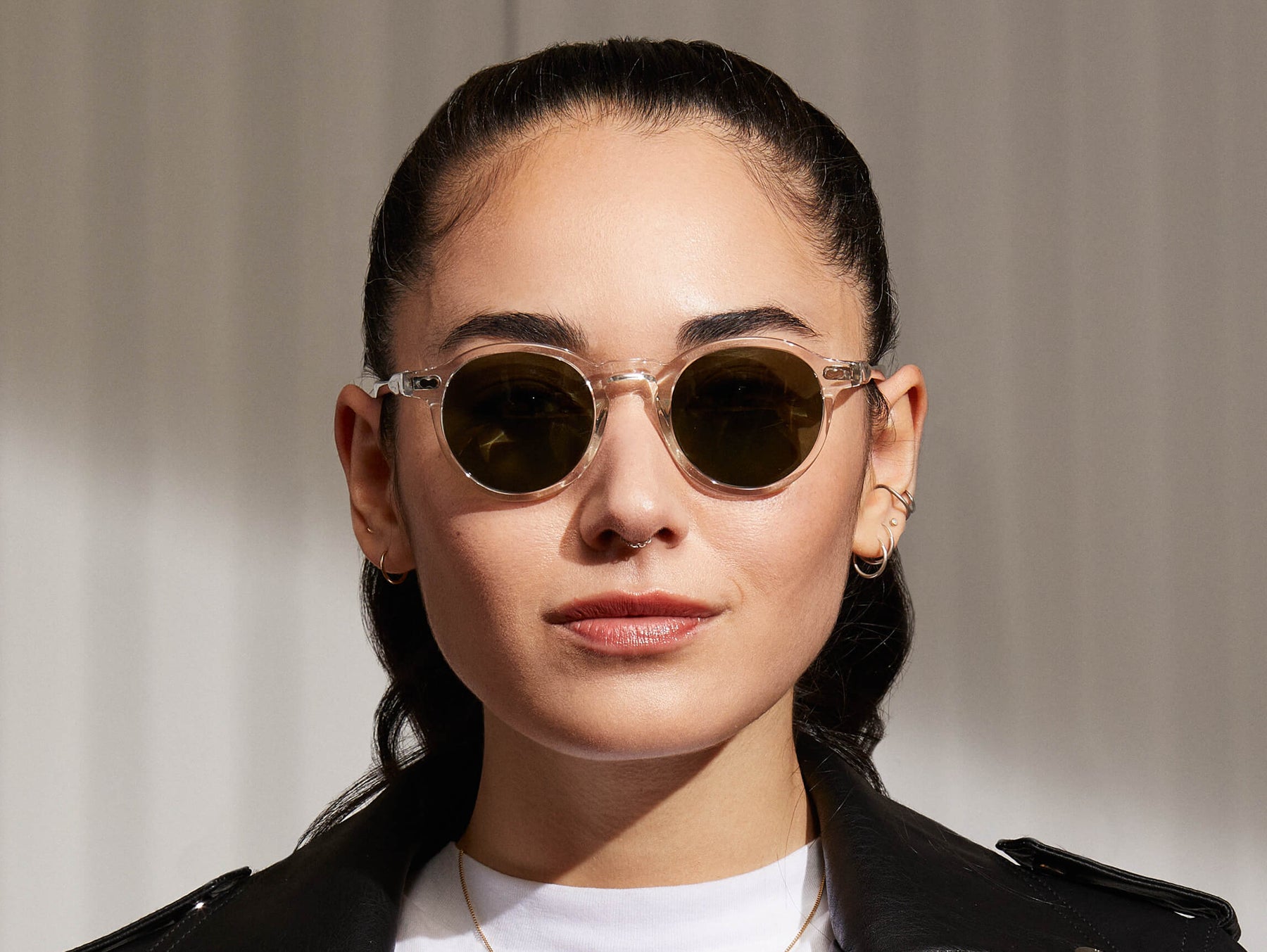 Model is wearing The MILTZEN SUN in Crystal in size 44 with G-15 Glass Lenses Model is wearing The MILTZEN SUN in Crystal in size 44 with G-15 Glass Lenses