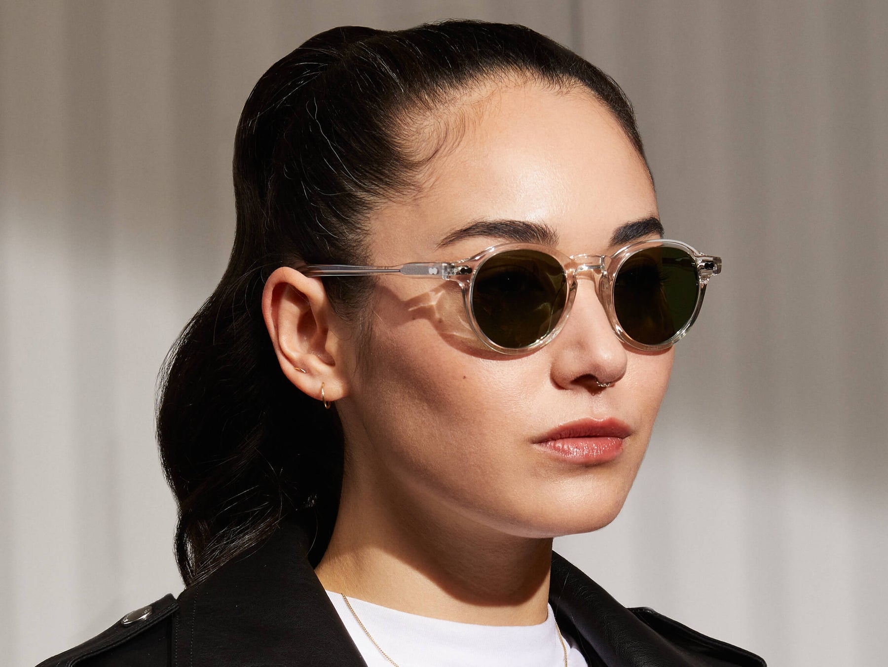 Model is wearing The MILTZEN SUN in Crystal in size 44 with G-15 Glass Lenses Model is wearing The MILTZEN SUN in Crystal in size 44 with G-15 Glass Lenses