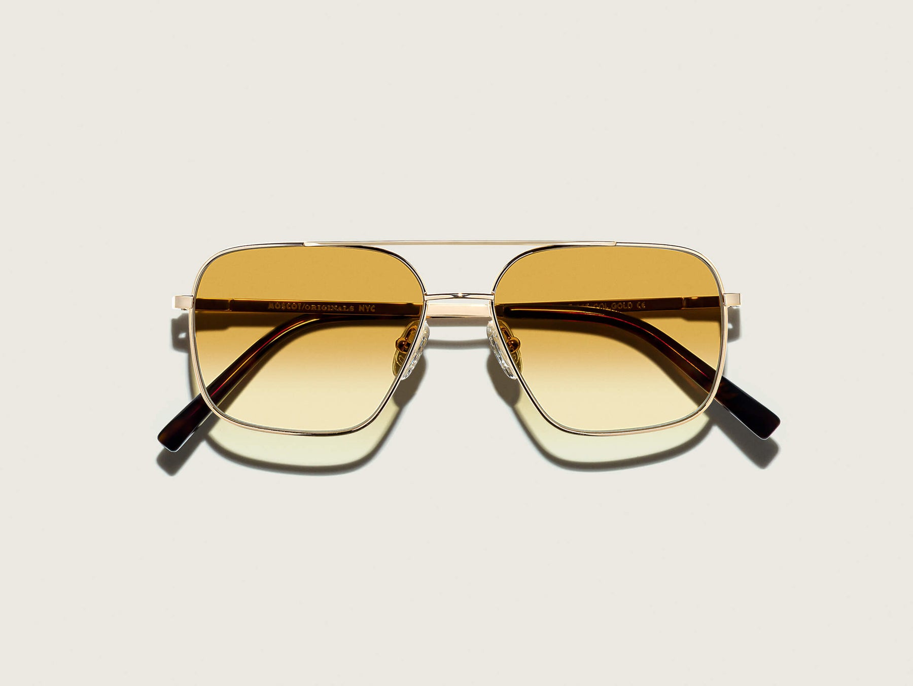 The SHTARKER in Gold with Chestnut Fade Tinted Lenses The SHTARKER in Gold with Chestnut Fade Tinted Lenses