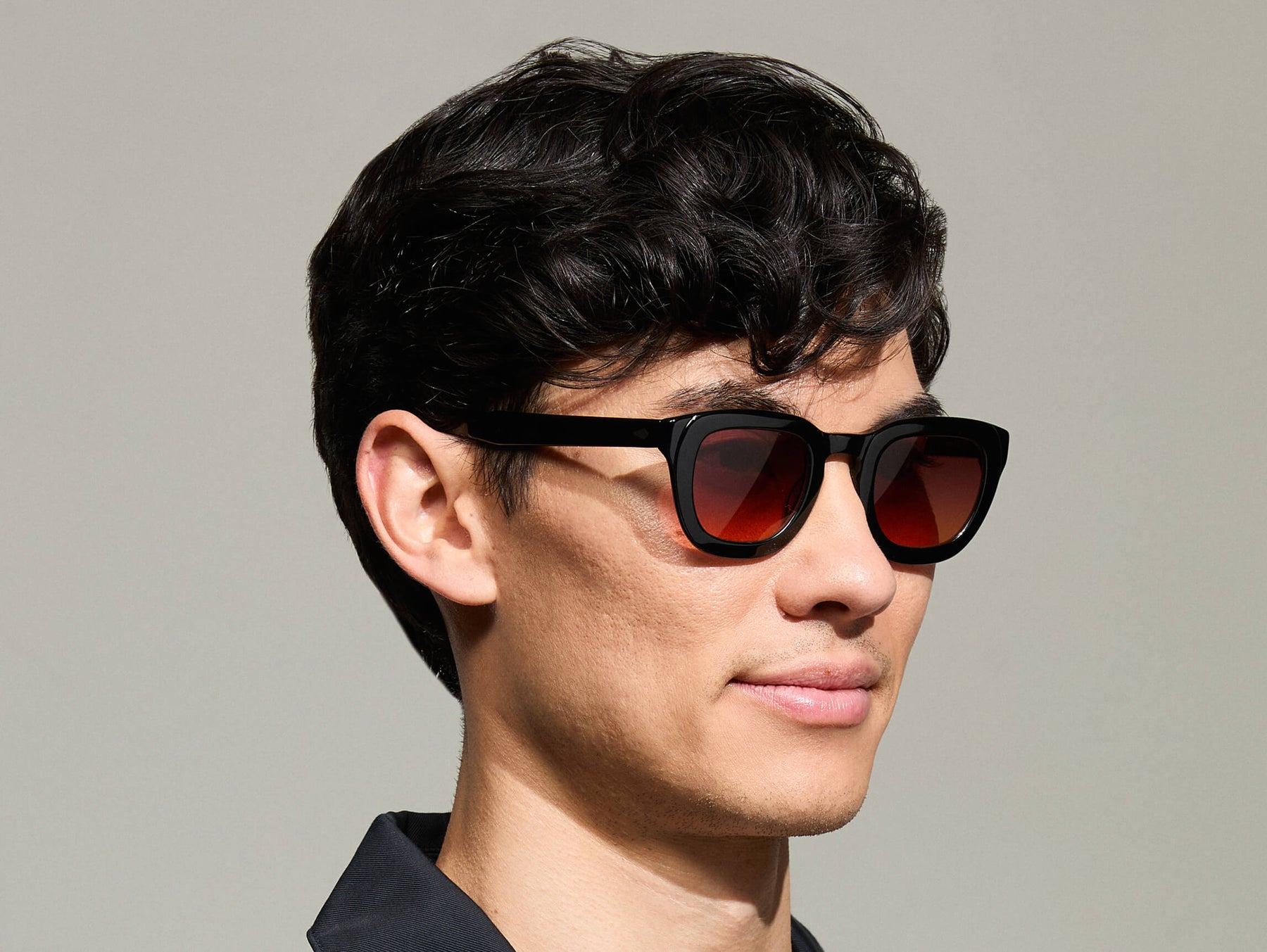 Model is wearing The TELENA in Black in size 47 with Cabernet Tinted Lenses Model is wearing The TELENA in Black in size 47 with Cabernet Tinted Lenses