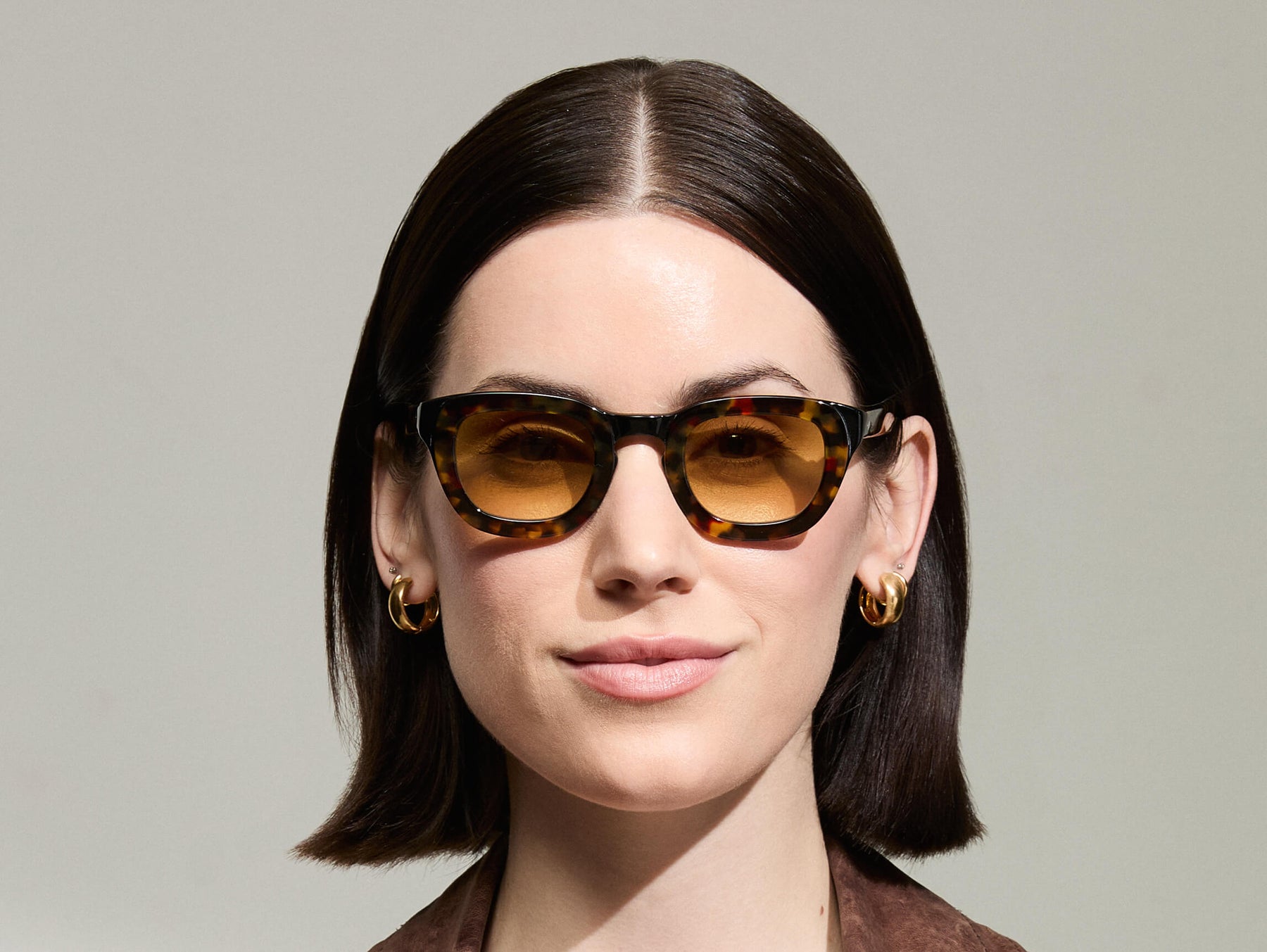 Model is wearing The TELENA  in Tortoise/Black in size 44 with Chestnut Fade Tinted Lenses Model is wearing The TELENA  in Tortoise/Black in size 44 with Chestnut Fade Tinted Lenses