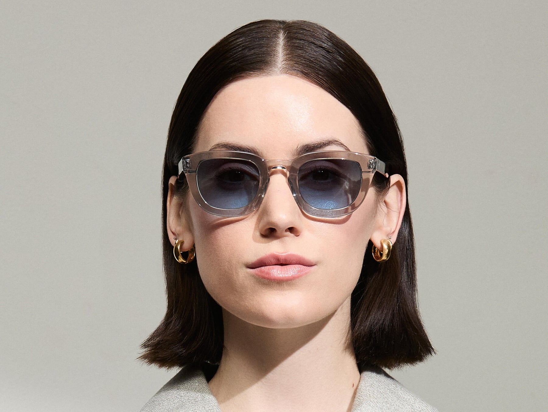 Model is wearing The TELENA in Grey/Light Grey in size 47 with Denim Blue Tinted Lenses Model is wearing The TELENA in Grey/Light Grey in size 47 with Denim Blue Tinted Lenses