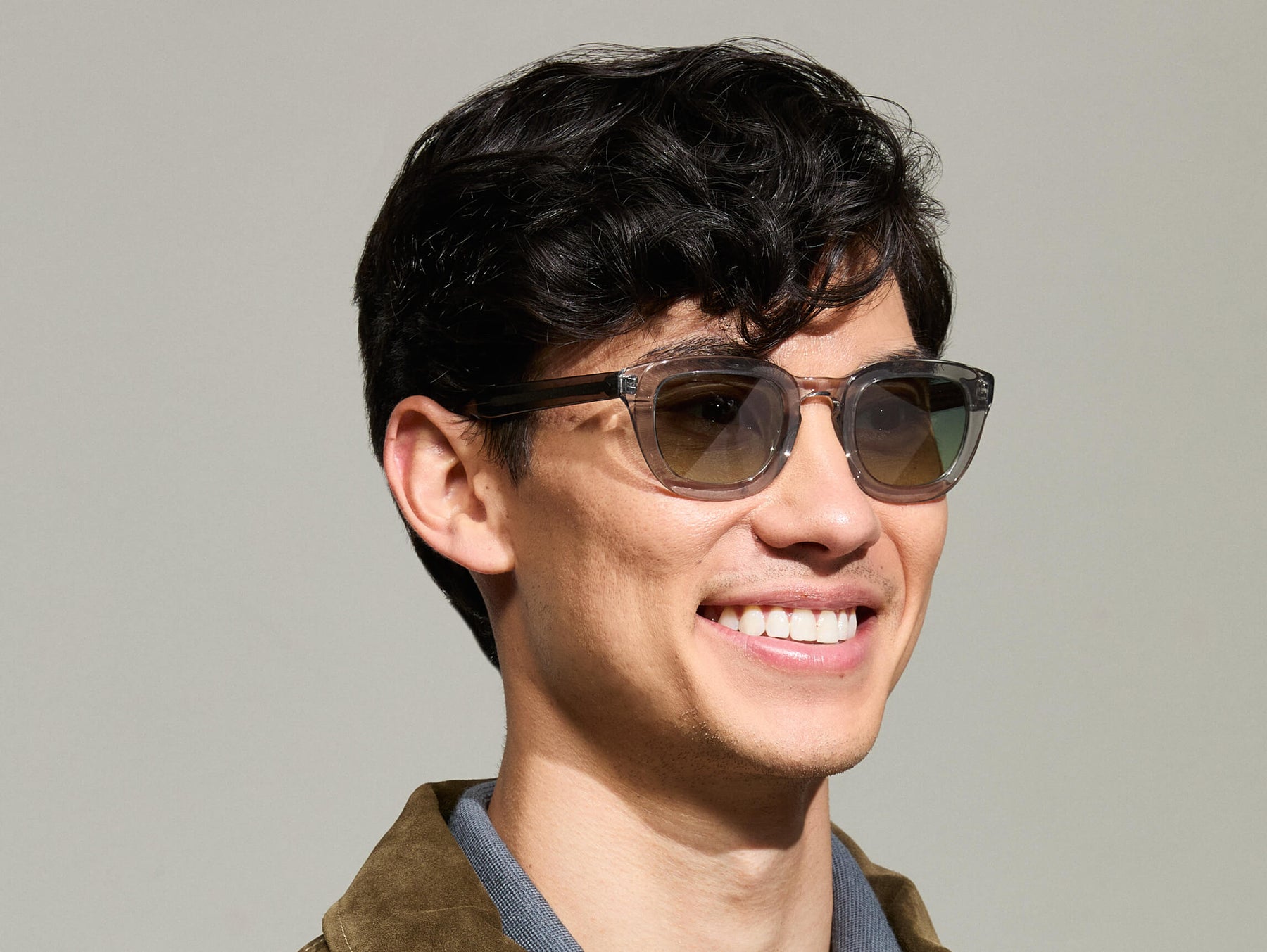 Model is wearing The TELENA in Grey/Light Grey in size 47 with Forest Wood Tinted Lenses Model is wearing The TELENA in Grey/Light Grey in size 47 with Forest Wood Tinted Lenses