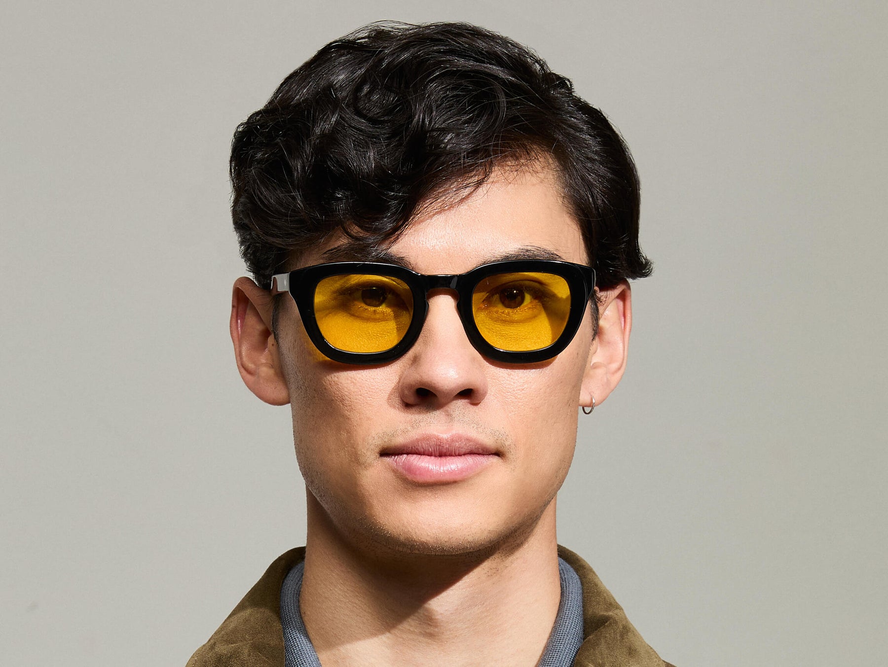 Model is wearing The TELENA in Black in size 47 with Mellow Yellow Tinted Lenses Model is wearing The TELENA in Black in size 47 with Mellow Yellow Tinted Lenses