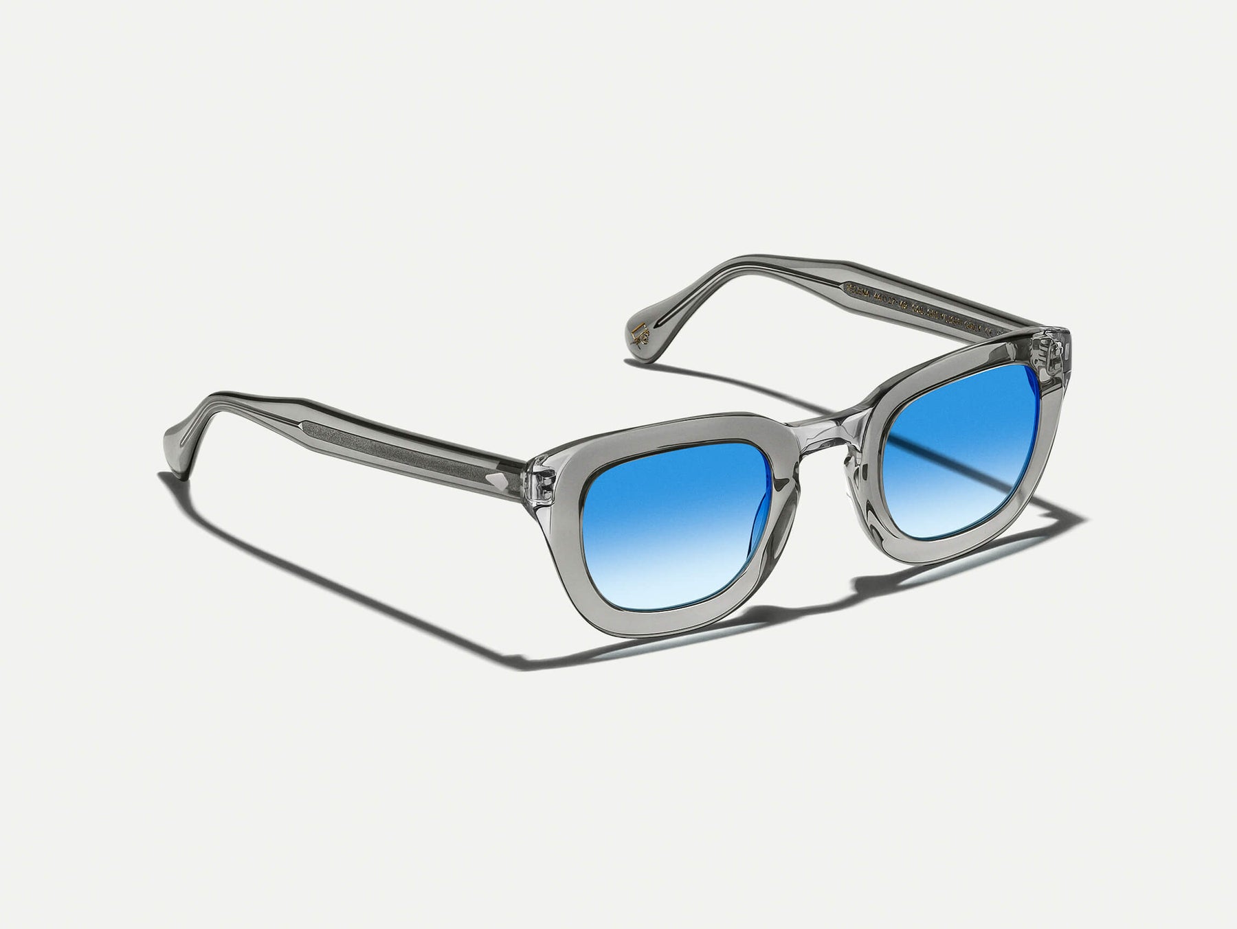 The TELENA in Grey/Light Grey with Broadway Blue Fade Tinted Lenses The TELENA in Grey/Light Grey with Broadway Blue Fade Tinted Lenses
