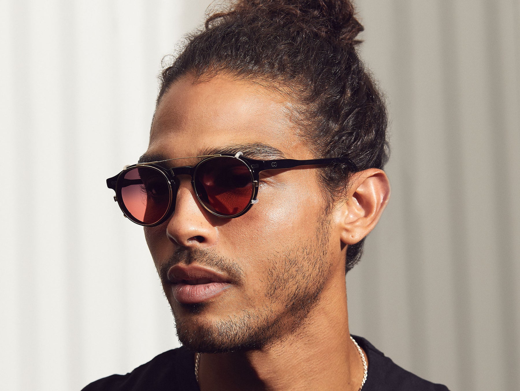 Model is wearing The CLIPZEN in Gold in size 46 with Cabernet Tinted Lenses Model is wearing The CLIPZEN in Gold in size 46 with Cabernet Tinted Lenses