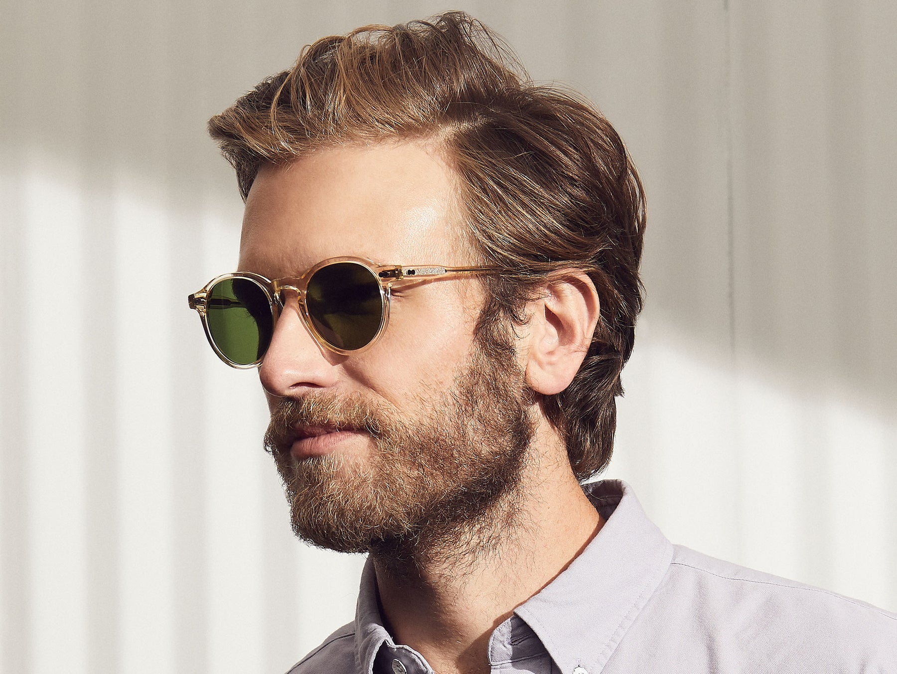 Model is wearing The MILTZEN SUN in Flesh in size 46 with Calibar Green Glass Lenses Model is wearing The MILTZEN SUN in Flesh in size 46 with Calibar Green Glass Lenses