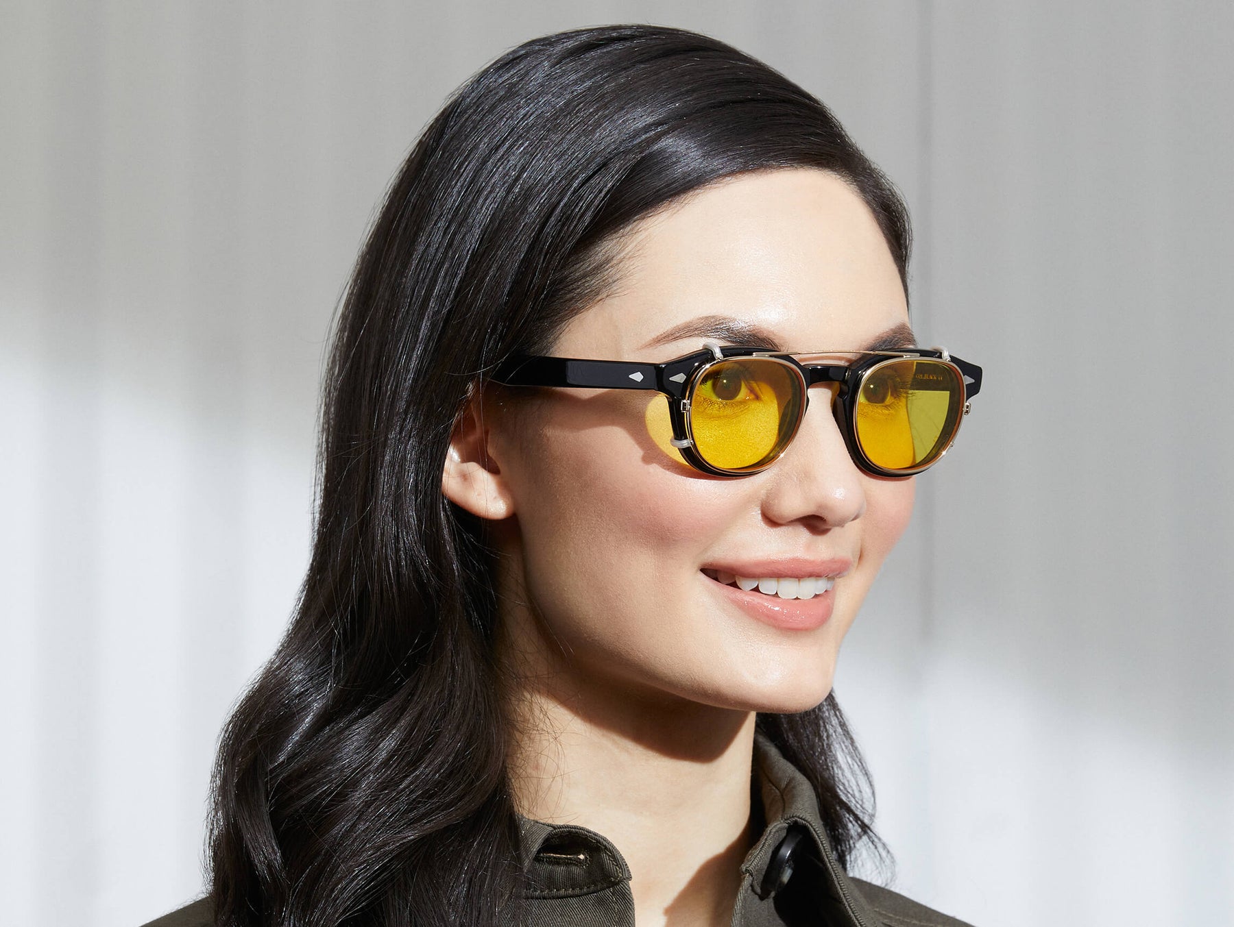 Model is wearing The CLIPTOSH in Gold in size 46 with Mellow Yellow Tinted Lenses Model is wearing The CLIPTOSH in Gold in size 46 with Mellow Yellow Tinted Lenses