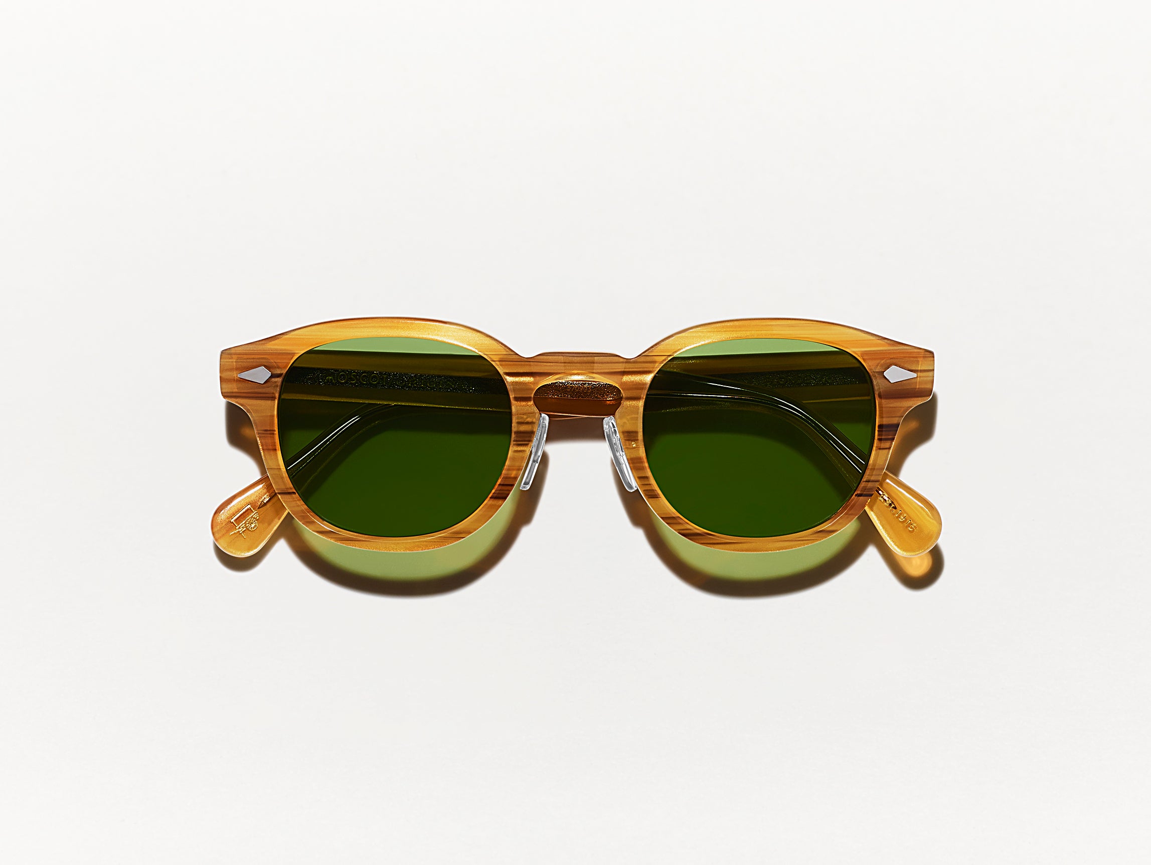 The LEMTOSH SUN with Metal Nose Pads in Blonde with Calibar Green Glass Lenses