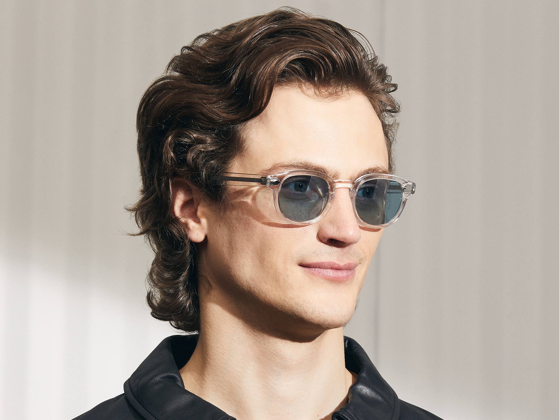 Model is wearing The LEMTOSH SUN in Crystal in size 46 with DG-37 Blue Glass Lenses Model is wearing The LEMTOSH SUN in Crystal in size 46 with DG-37 Blue Glass Lenses