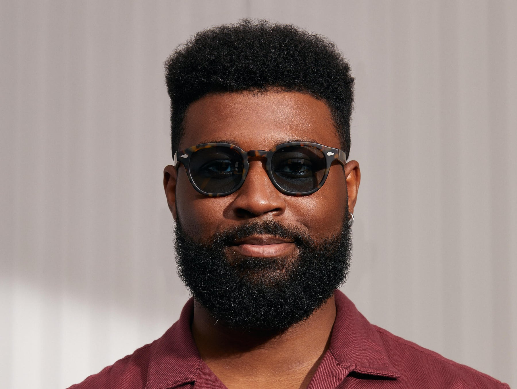 Model is wearing The LEMTOSH SUN in Matte Tortoise in size 49 with Blue Glass Lenses Model is wearing The LEMTOSH SUN in Matte Tortoise in size 49 with Blue Glass Lenses