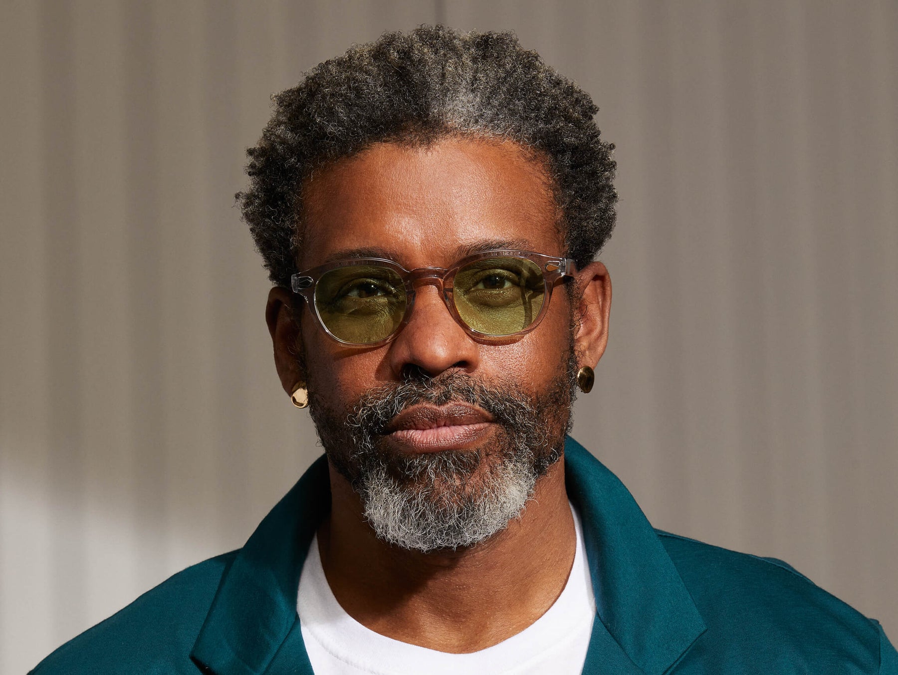 Model is wearing The LEMTOSH in Light Grey in size 49 with Limelight Tinted Lenses Model is wearing The LEMTOSH in Light Grey in size 49 with Limelight Tinted Lenses