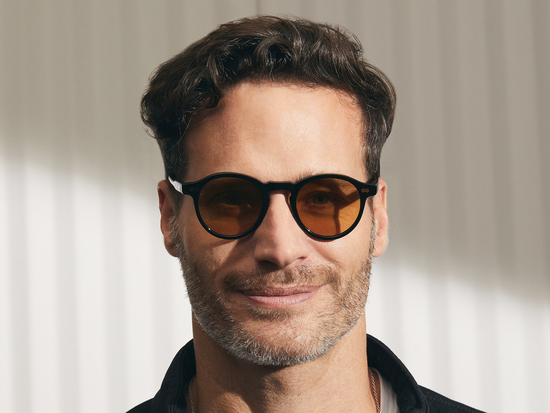 Model is wearing The MILTZEN in Black in size 46 with Amber Tinted Lenses Model is wearing The MILTZEN in Black in size 46 with Amber Tinted Lenses