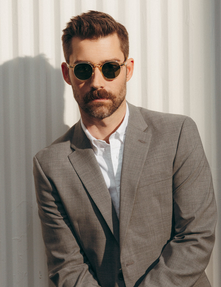 Model is wearing The MILTZEN SUN in Flesh in size 49 with Calibar Green Glass Lenses Model is wearing The MILTZEN SUN in Flesh in size 49 with Calibar Green Glass Lenses