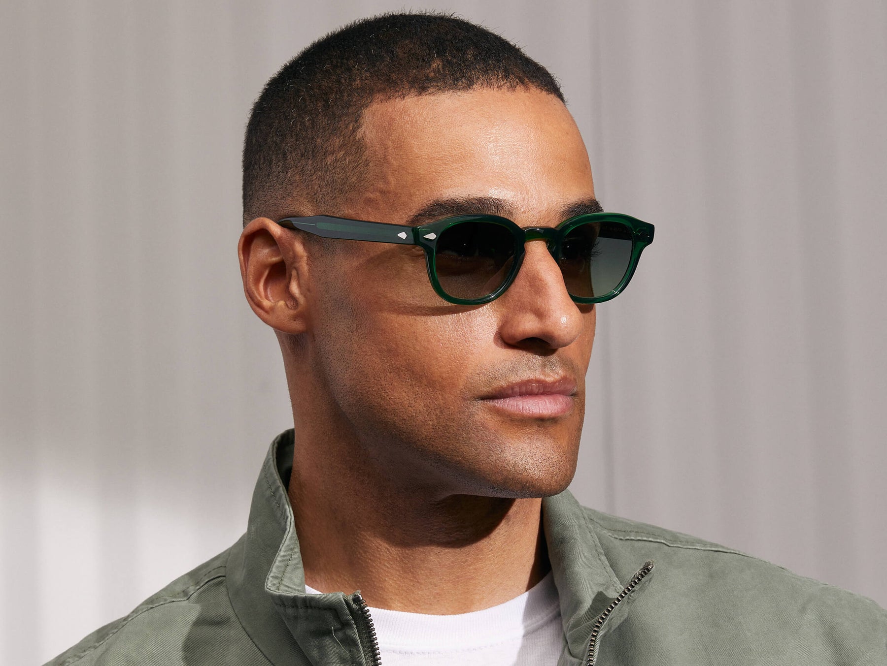 Model is wearing The LEMTOSH in Emerald in size 46 with Forest Wood Tinted Lenses Model is wearing The LEMTOSH in Emerald in size 46 with Forest Wood Tinted Lenses