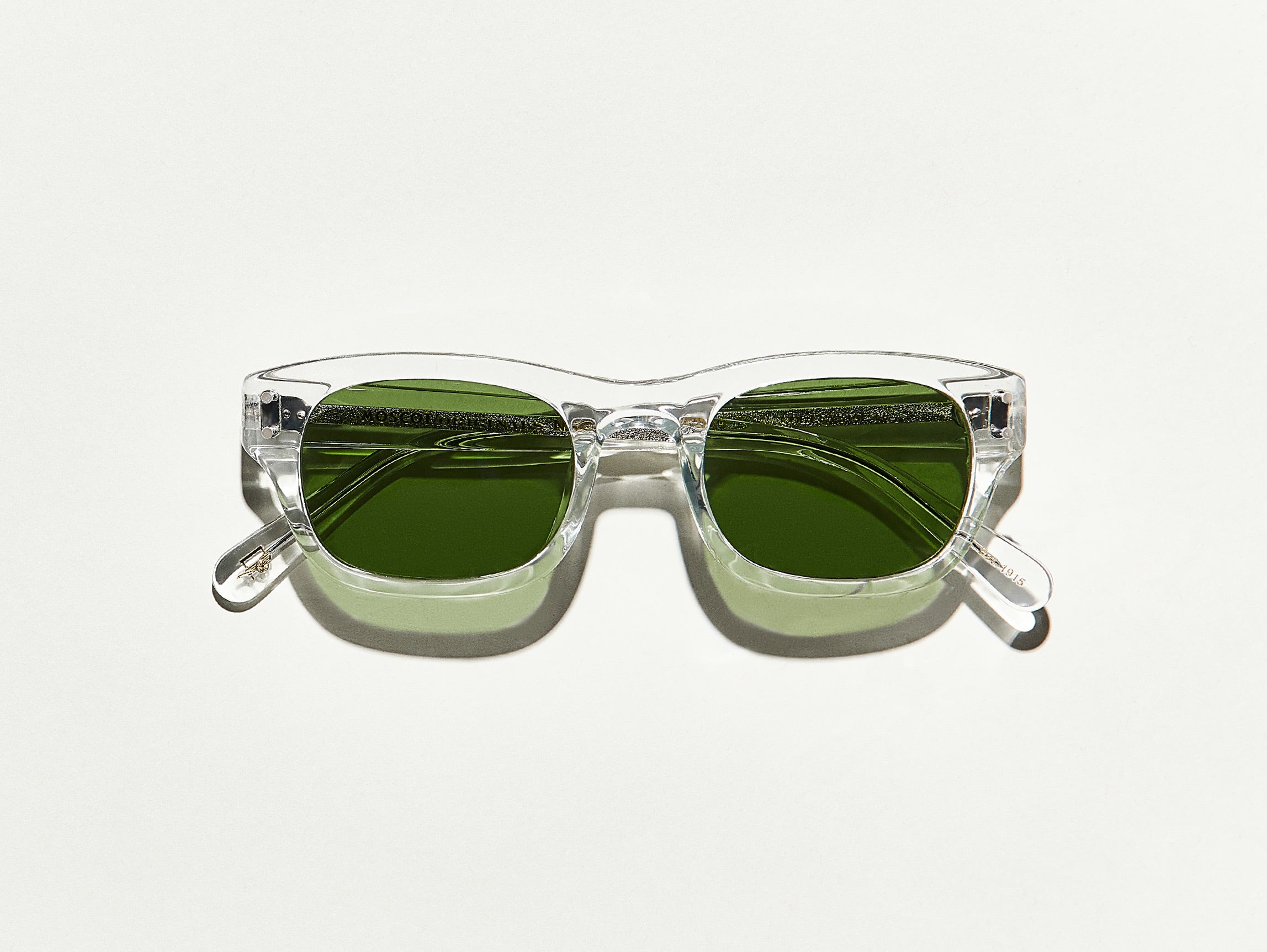 The NEBB SUN in Crystal with Calibar Green Glass Lenses