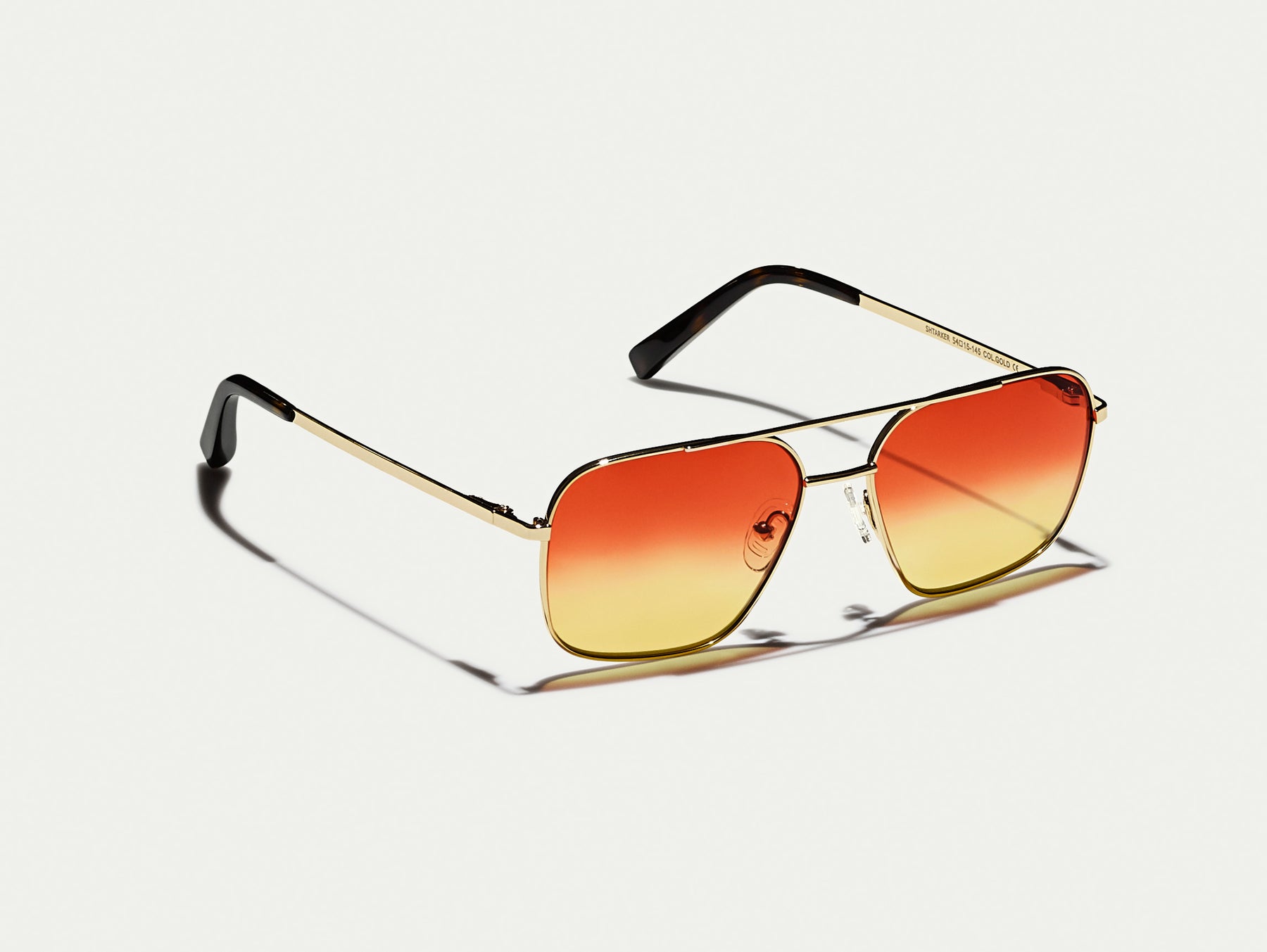 The SHTARKER in Gold with Candy Corn Tinted Lenses The SHTARKER in Gold with Candy Corn Tinted Lenses